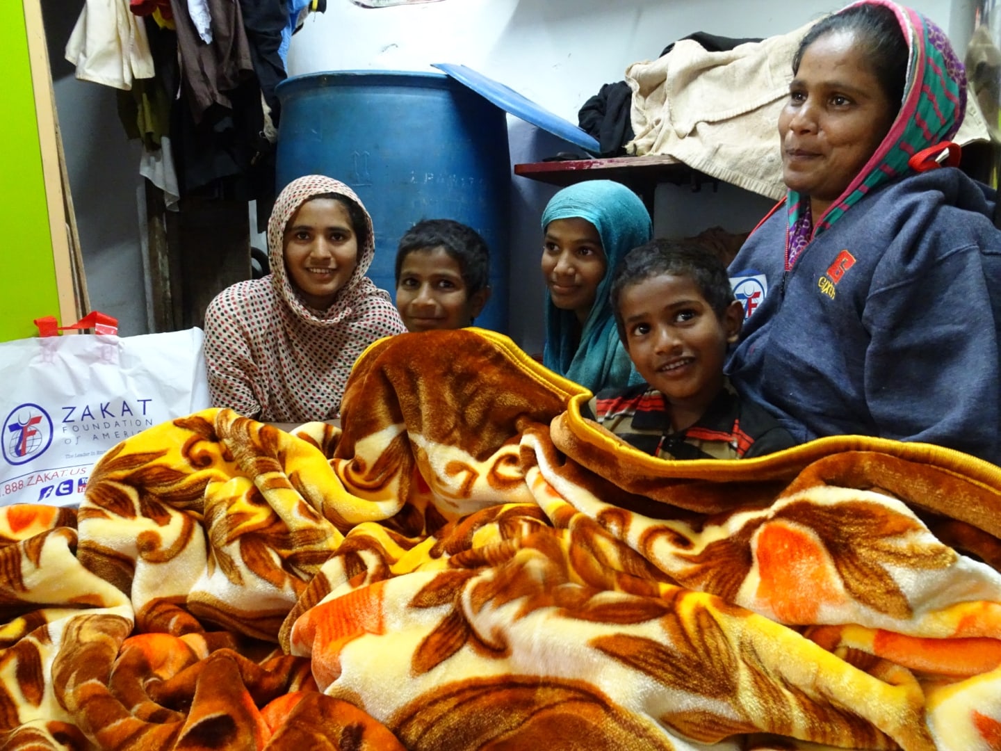Families, and especially refugees, often struggle to survive a hard winter, but blankets from Zakat Foundation provide help and hope. / غالبًا ما تكافح الأسر، وخاصة اللاجئين، للبقاء على قيد الحياة خلال فصل الشتاء القاسي، ولكن البطانيات المقدمة من مؤسسة الزكاة توفر لهم الدفء والأمل