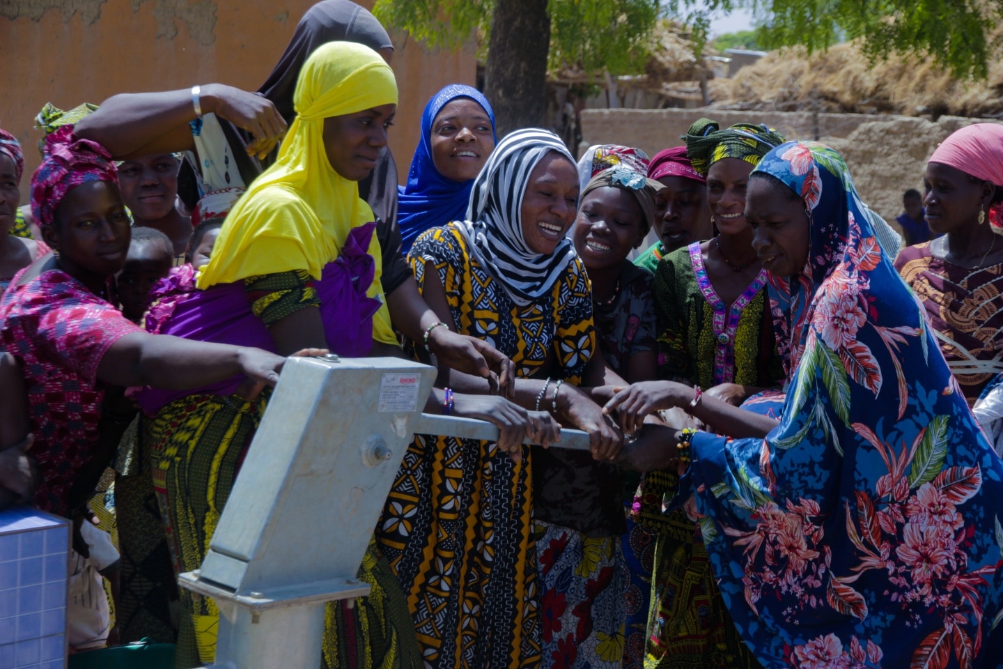 Women in Mali celebrate access to clean water as respite from long dangerous walks to contaminated water sources.