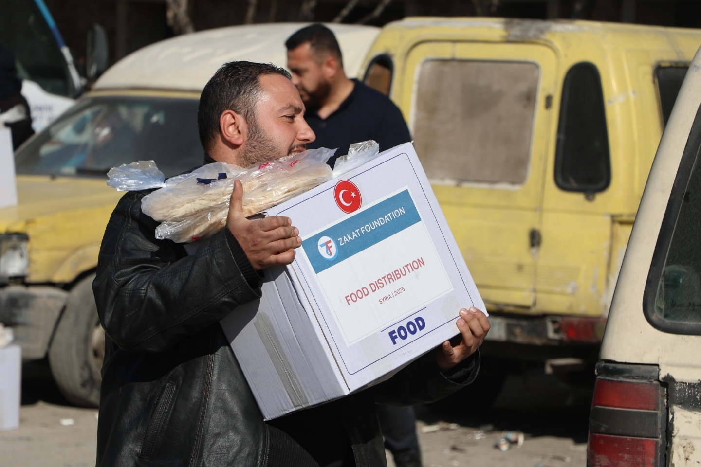 Food boxes with essentials are taken by displaced, needy and returning Syrian families.
