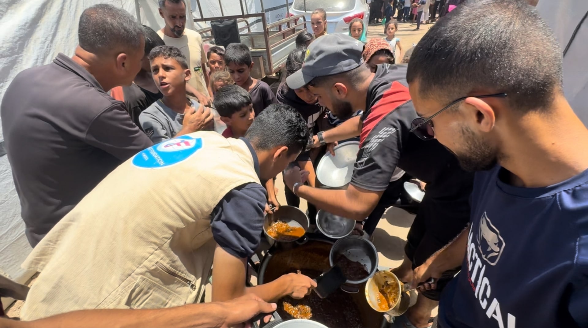 Children in Gaza receive hot meals.