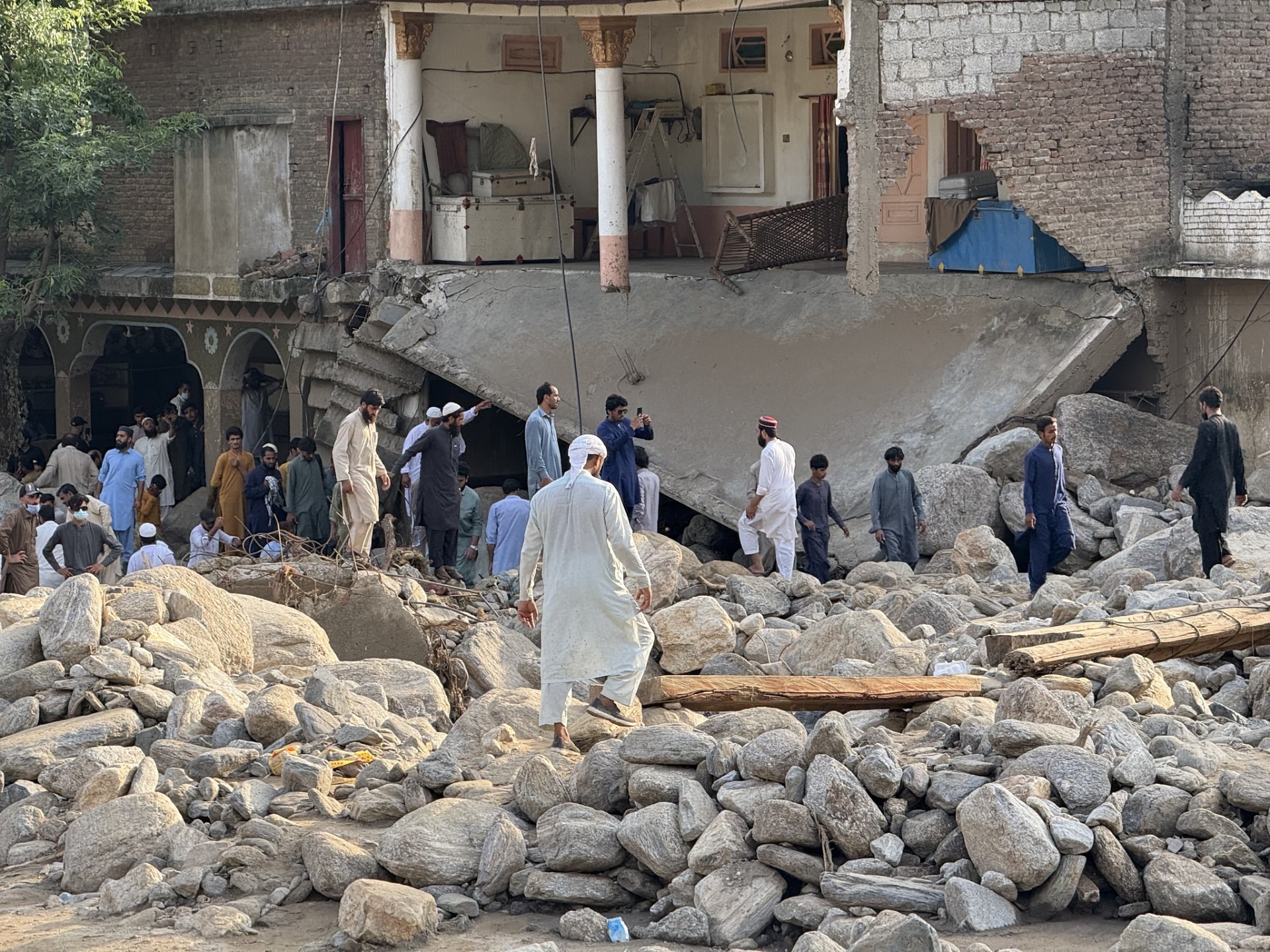 Rushing flood waters left large boulders and debris in its path in the aftermath of Pakistan floods.