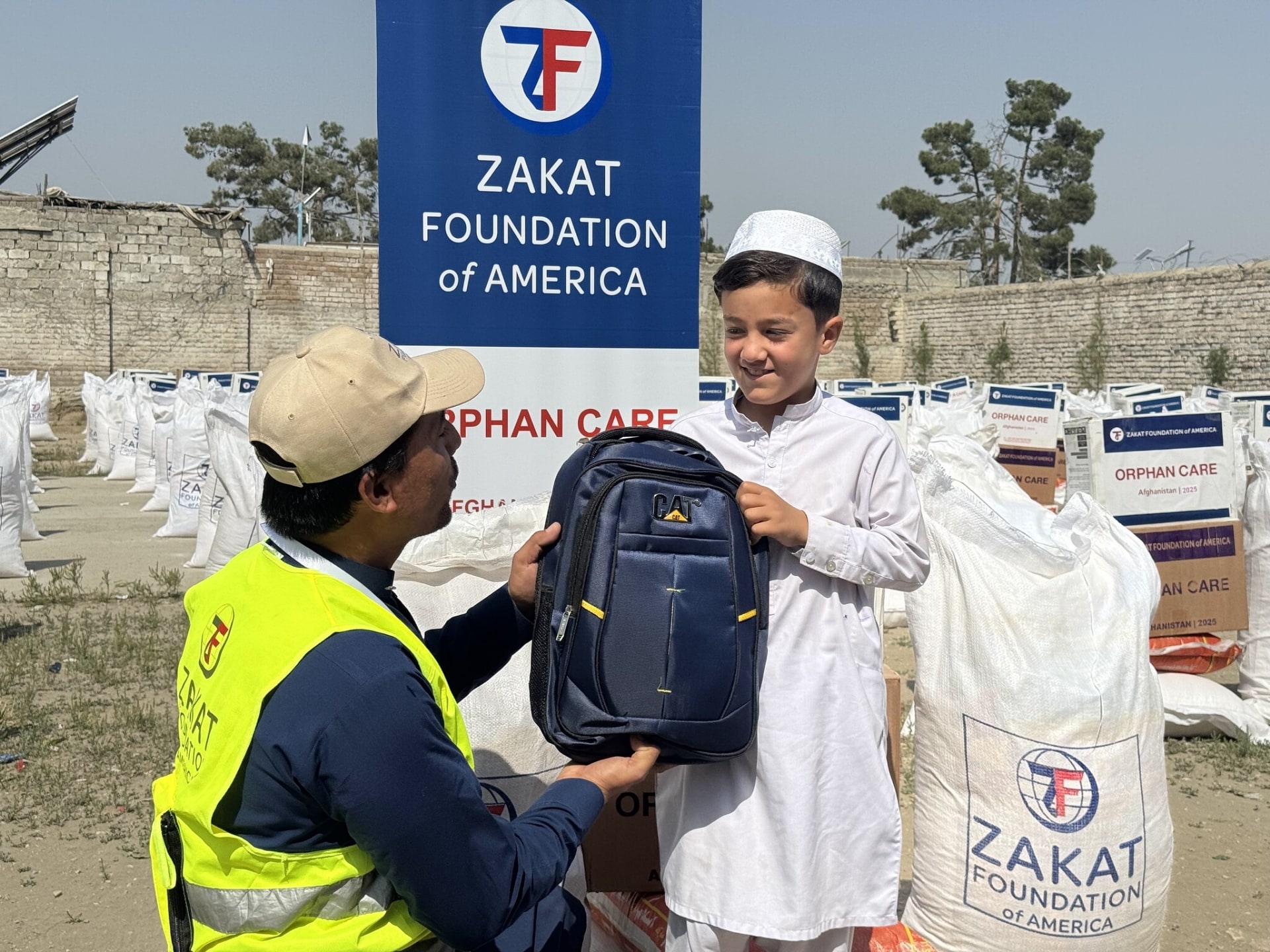 Thanks to your support, an orphan boy in Afghanistan receives a school bag, gaining access to education and a brighter future.