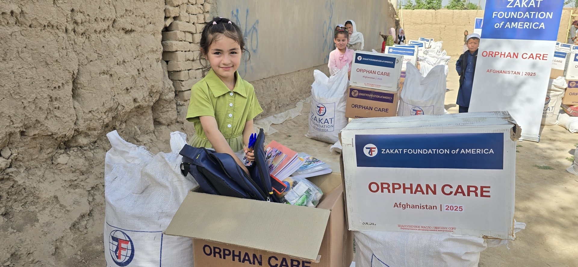 Your support helps an orphan girl in Afghanistan receive school supplies from Zakat Foundation of America, ready to begin her journey in education.