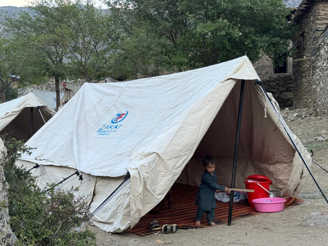 A little Afghan boy plays in the shelter tent as our teams continue aid distribution in Afghanistan.