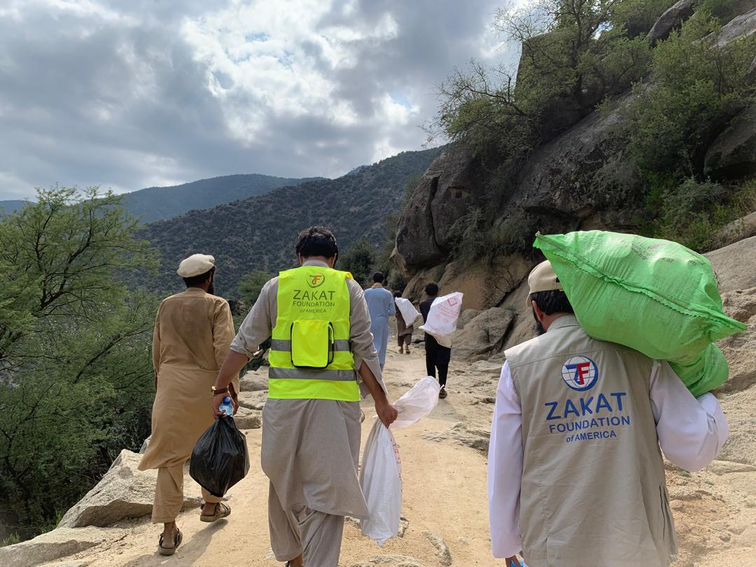Emergency relief items are taken on foot by our field teams to help Afghanistan earthquake survivors