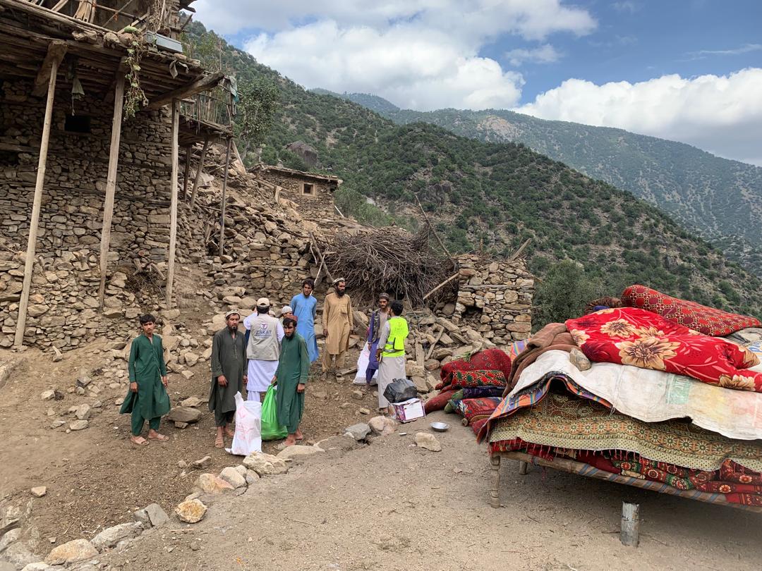 Families save their belonging from the rubble in the aftermath of the Afghanistan earthquake