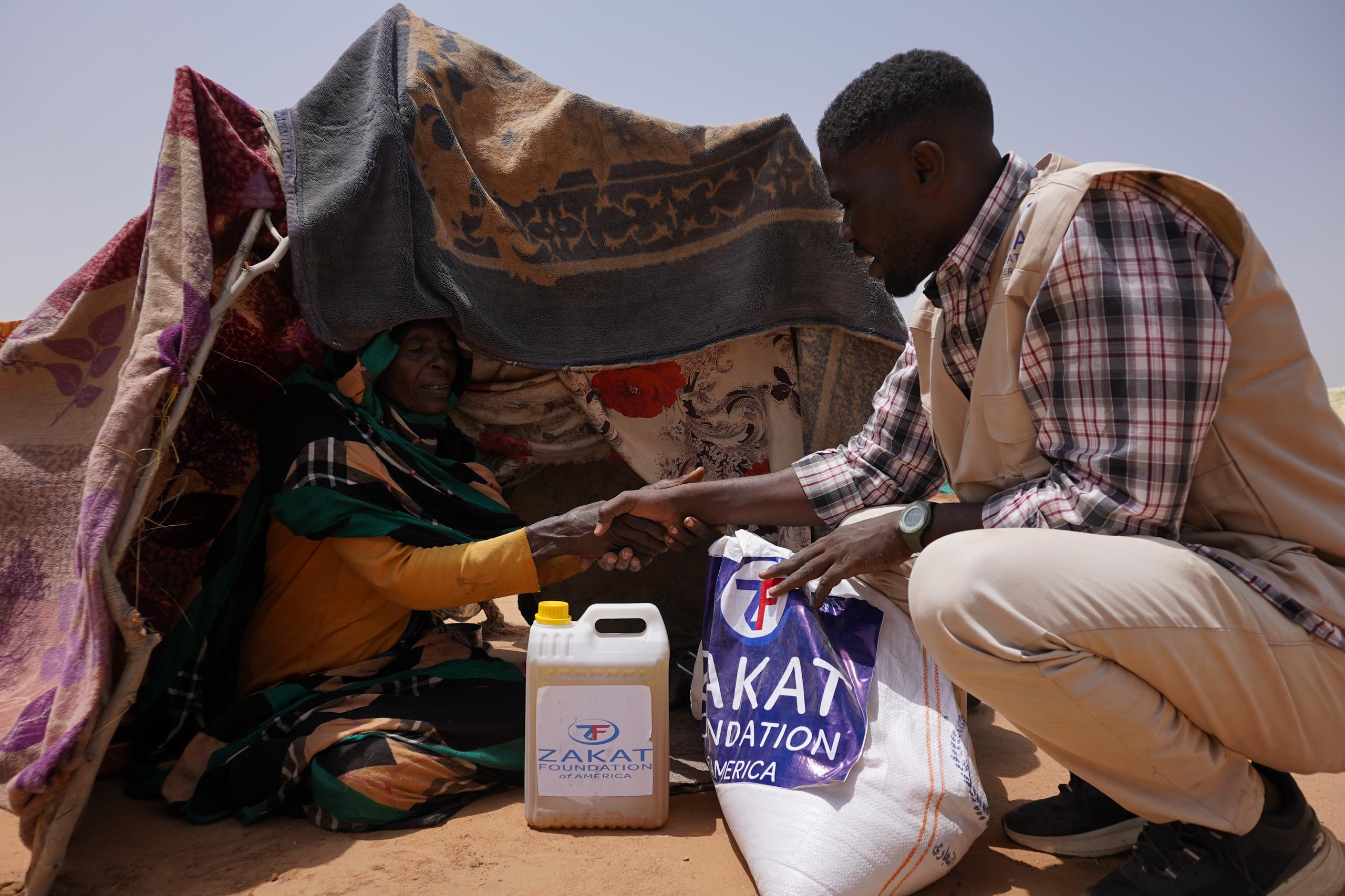 A tender moment holds more than words can express as our team delivers food to displaced Sudanese families