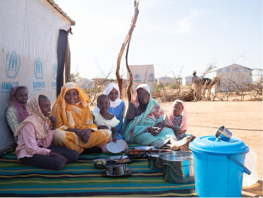 A displaced Sudanese family receive emergency relief items from our field teams