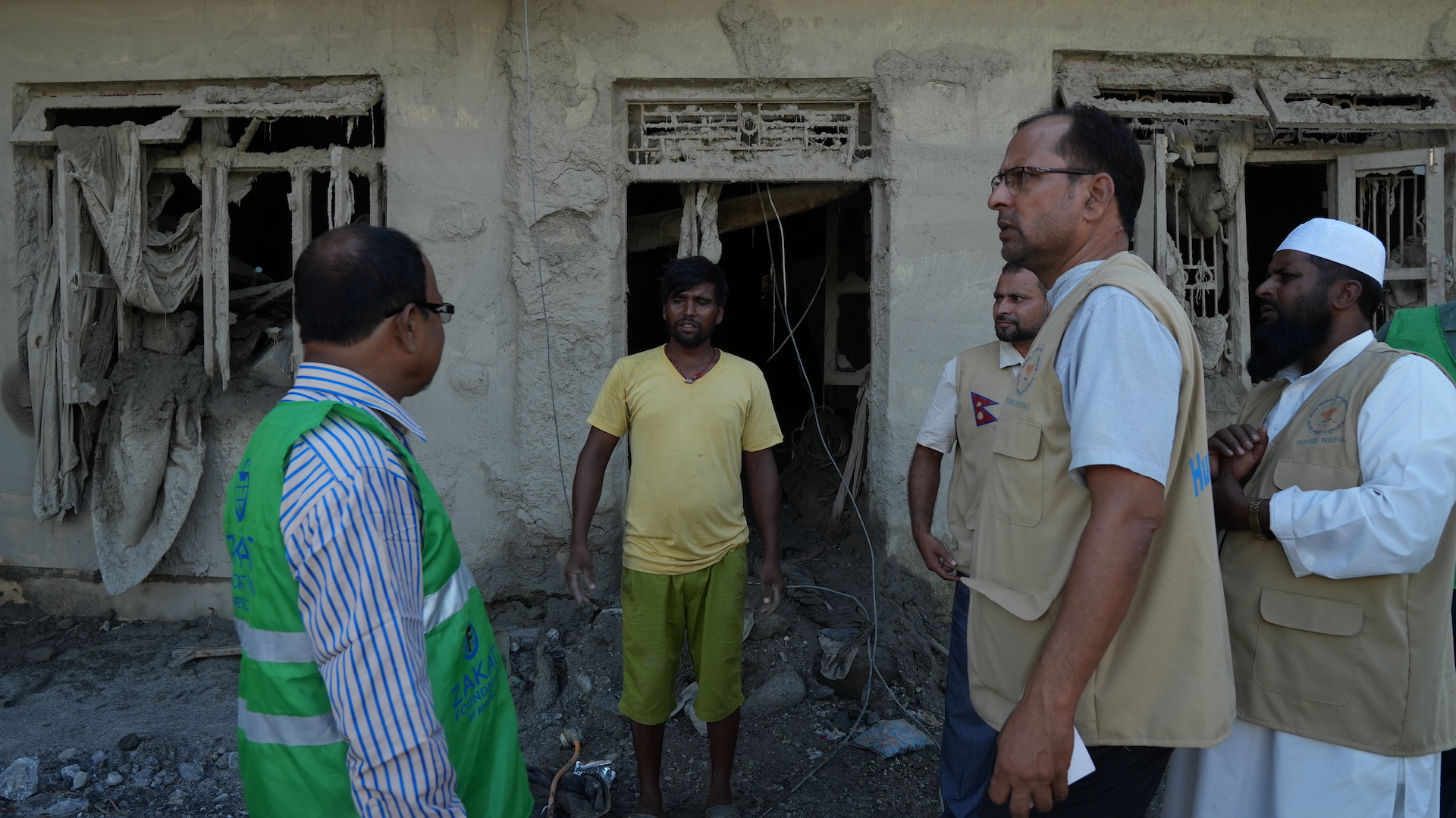 A man in Nepal speaks with our team in the aftermath of floods