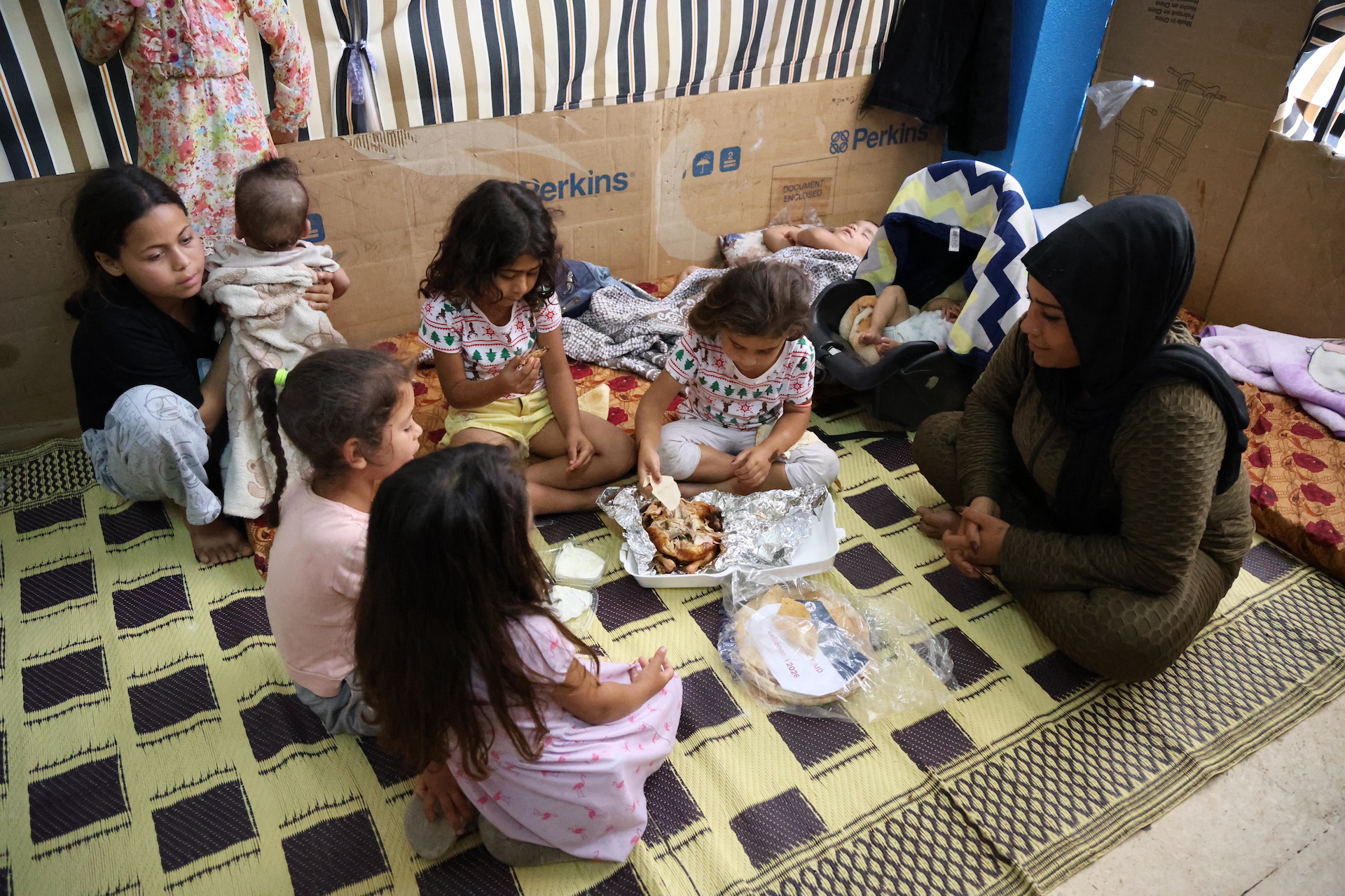 A mother gathers around with her children for a nourishing meal