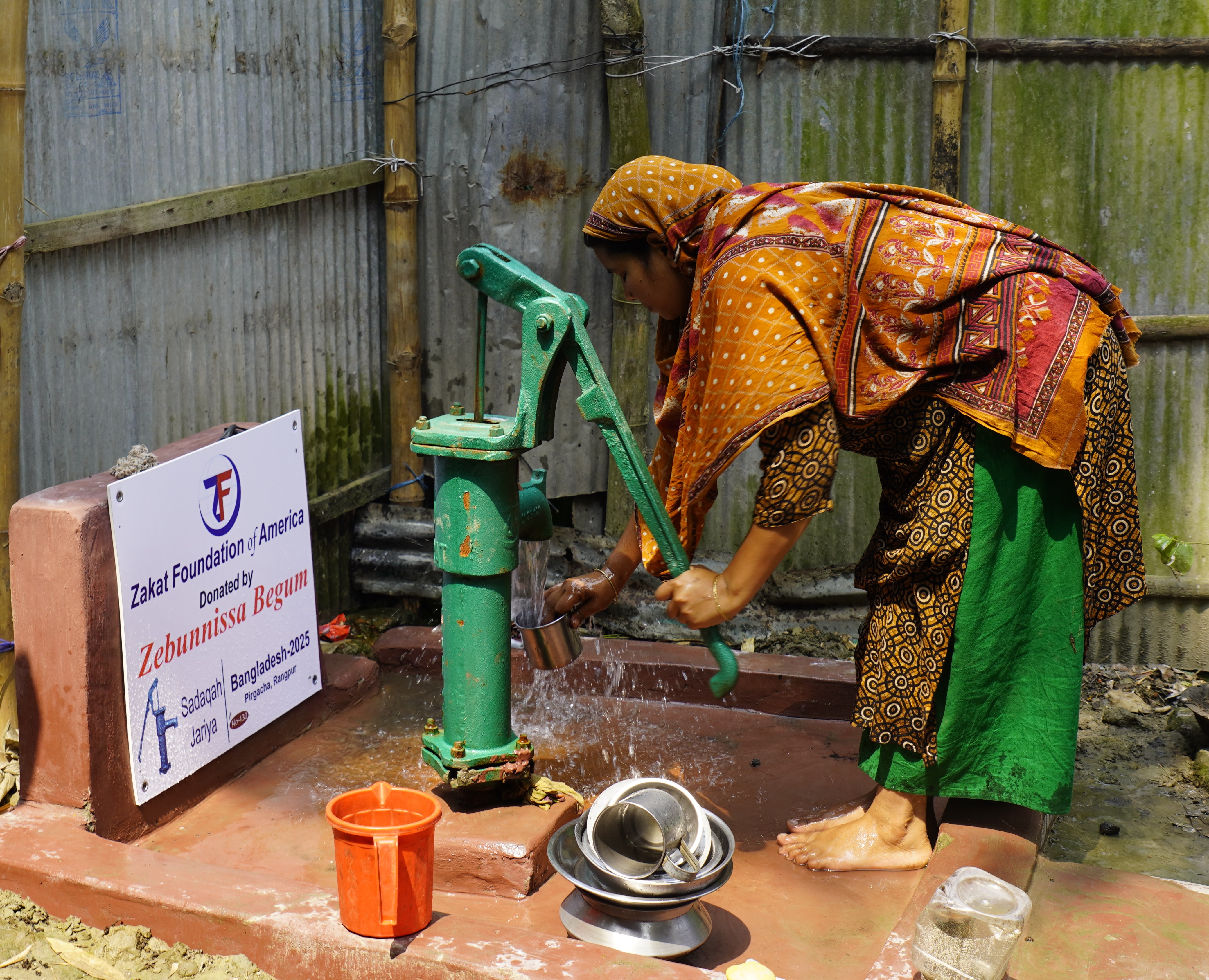 A mother in Bangladesh secures clean water at our local water well