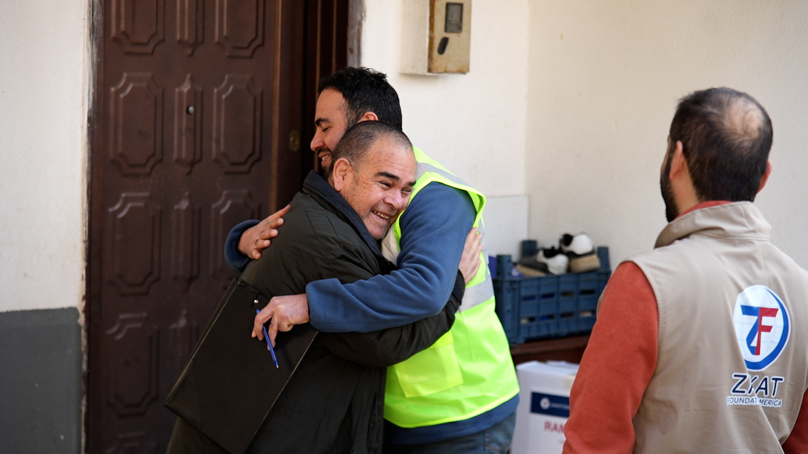 A tender embrace between a food package recipient and a field rep is a beautiful reminder of hope