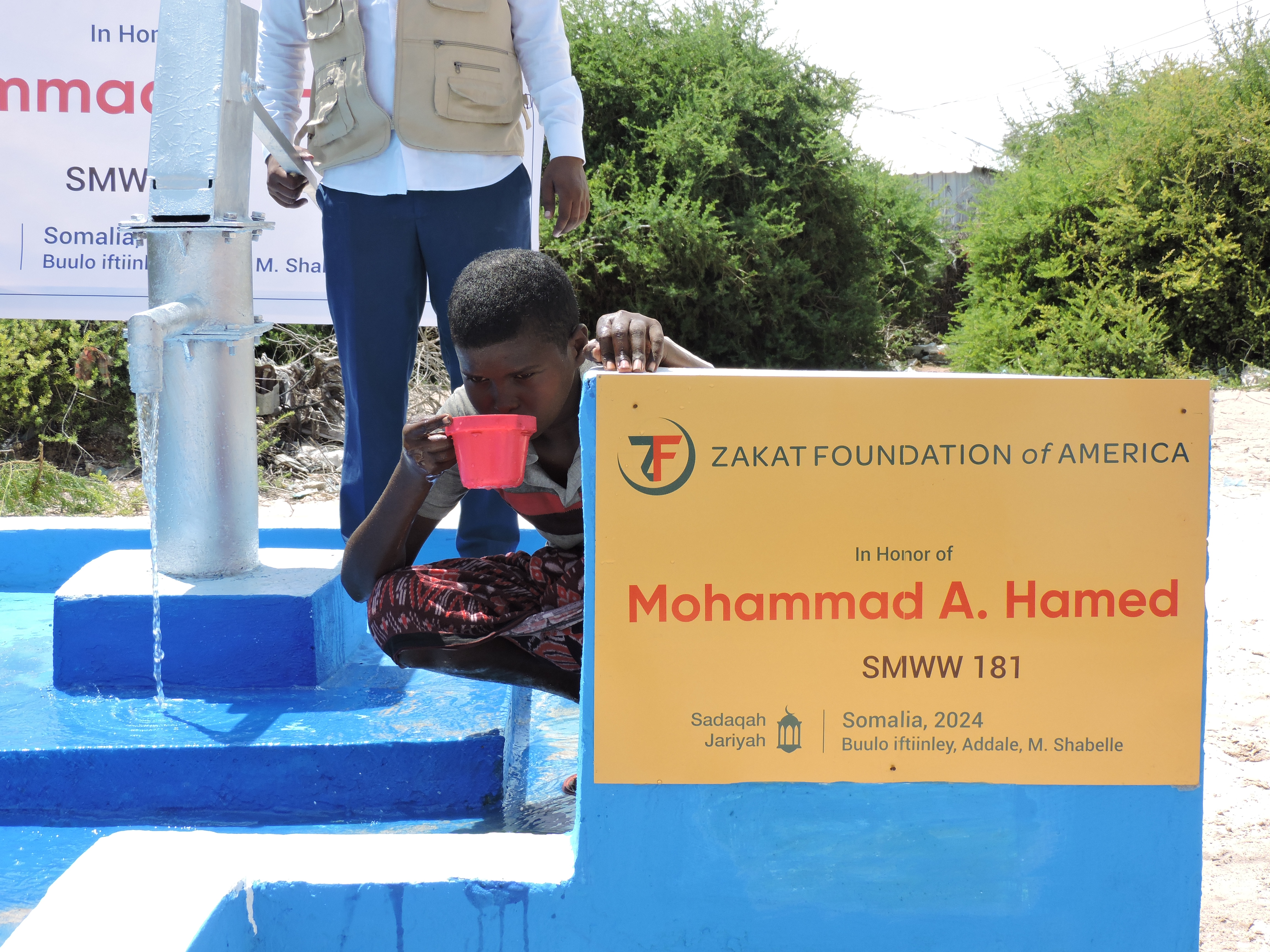 A young Somali boy enjoys his first sip of clean water from our newly constructed well