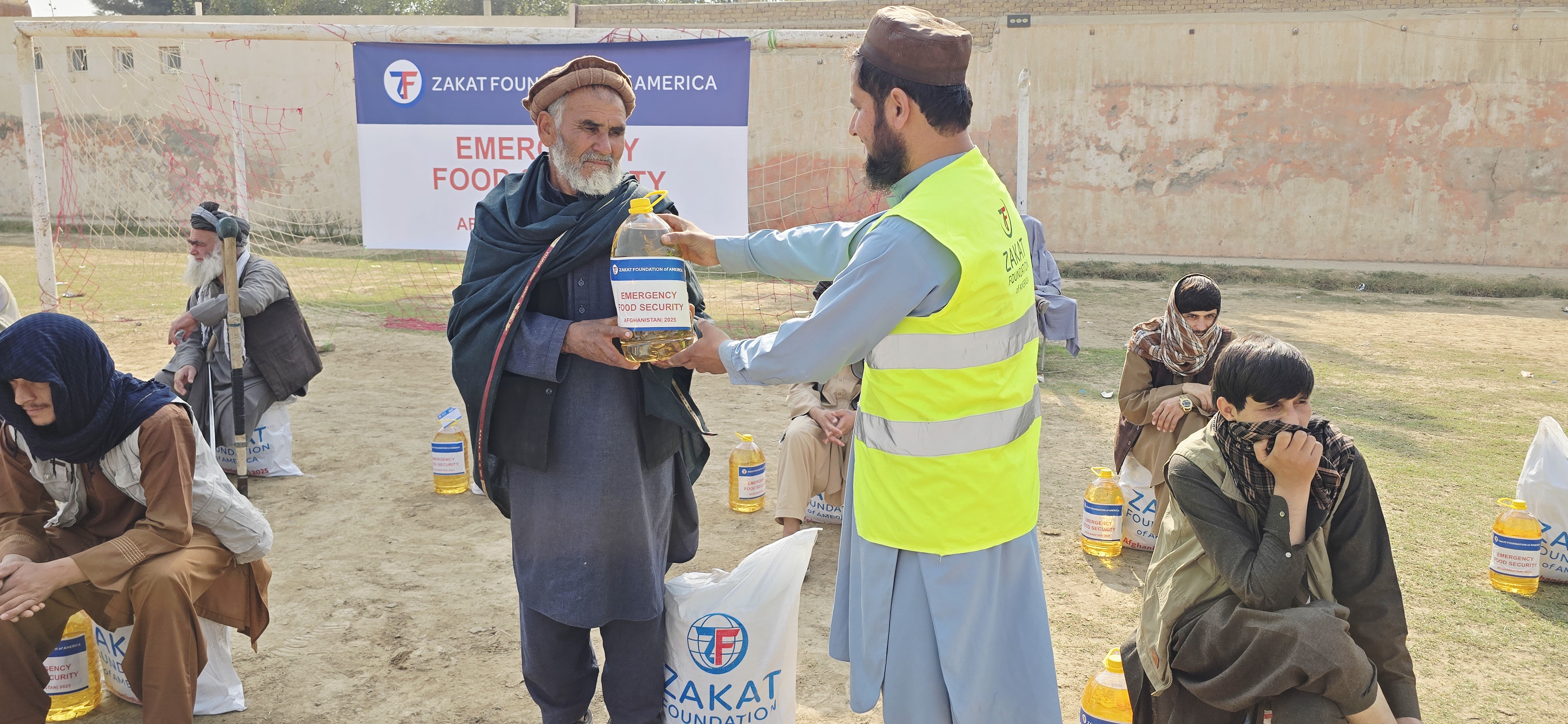 Afghan refugees returning from Iran receive emergency food packages as they start anew