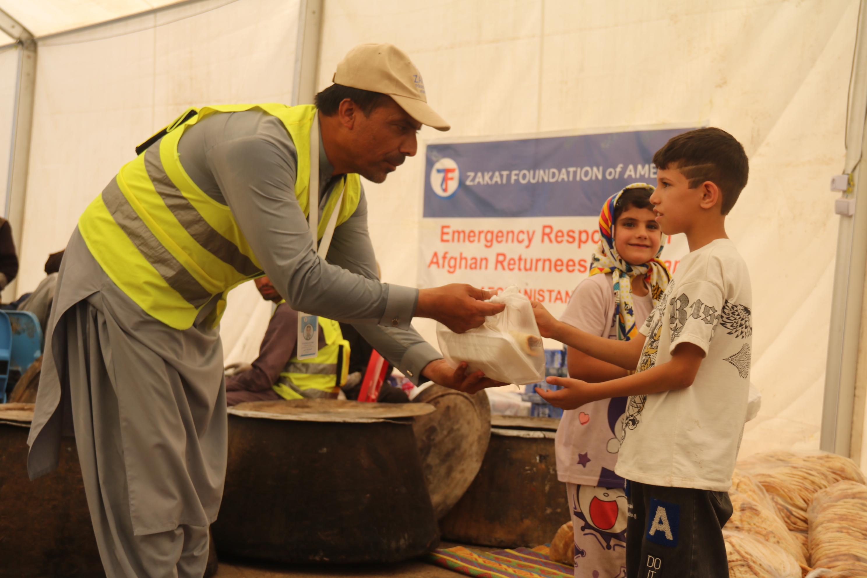 An Afghan boy received a nourishing hot meal from our team member