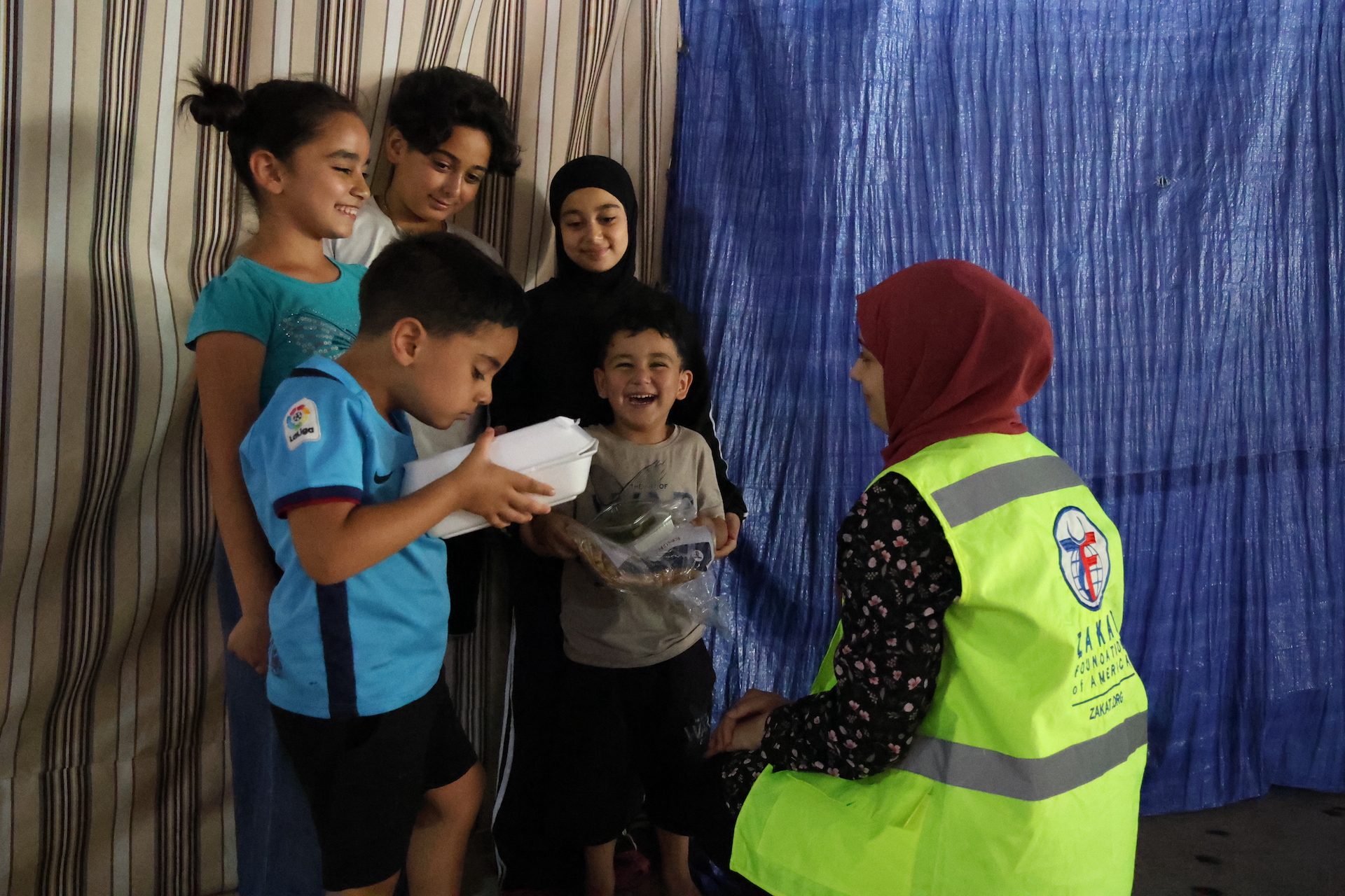 Children are overjoyed at receiving a warm meal