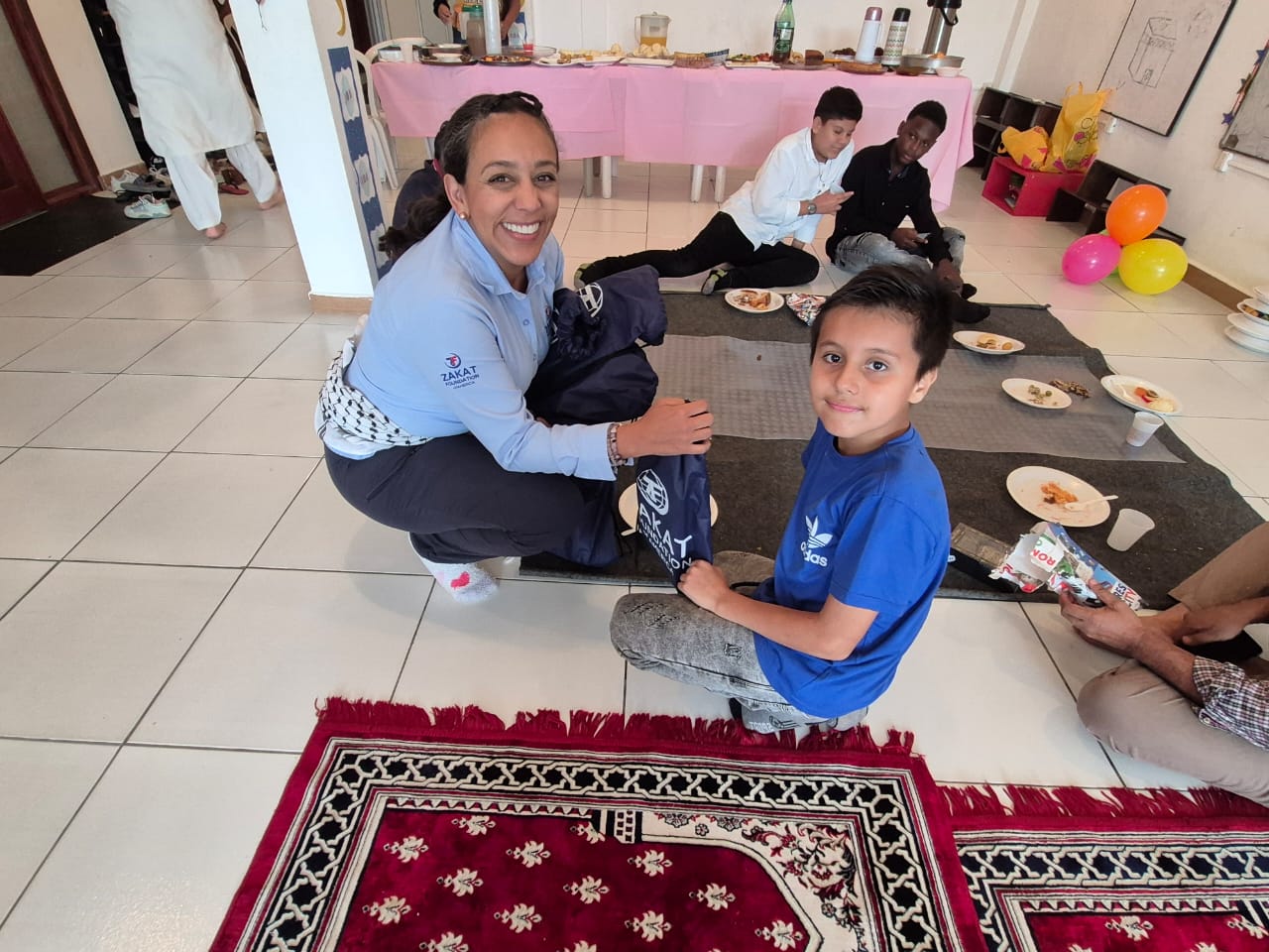 Children enjoy a meal and recreational time with our teams