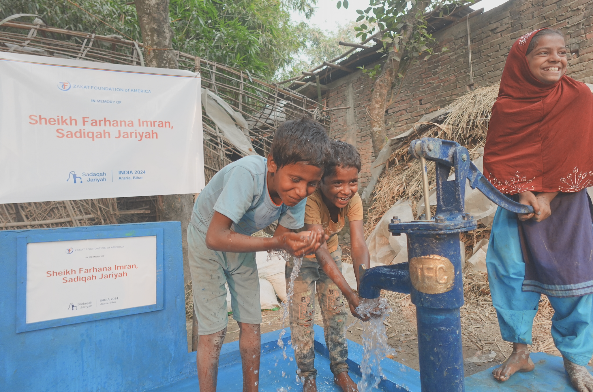 Children in India enjoy fresh, clean water from a sponsored handpump