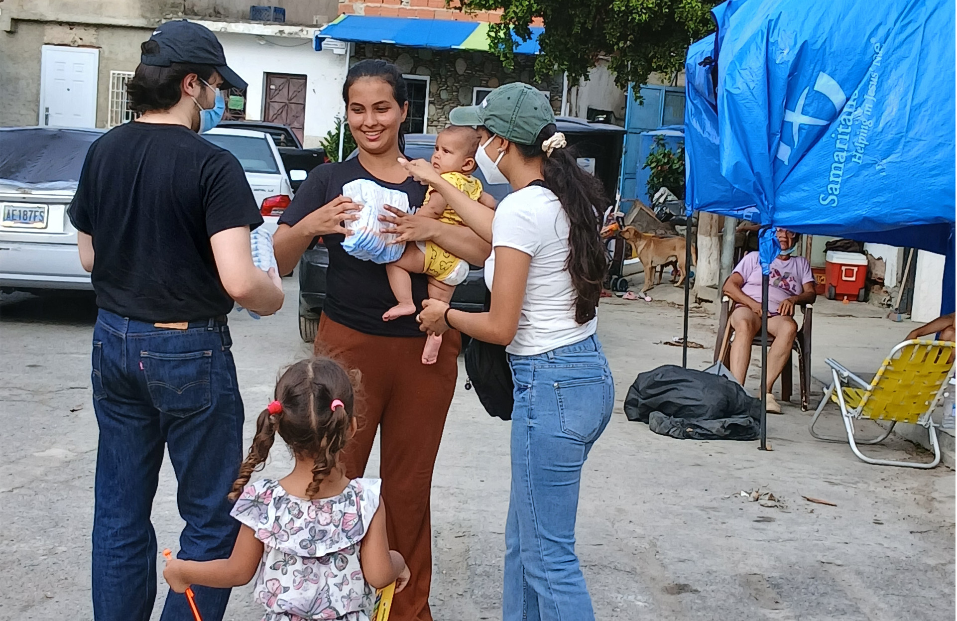 Diapers and other children staples are given to families by our teams