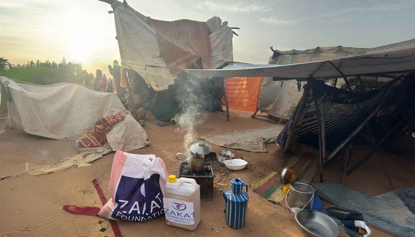 Displaced families receive emergency relief supplies with staple items