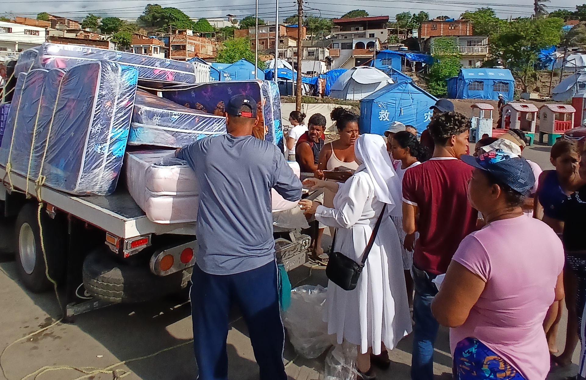 Earthquake survivors collect mattresses and other essentials at our distribution sight