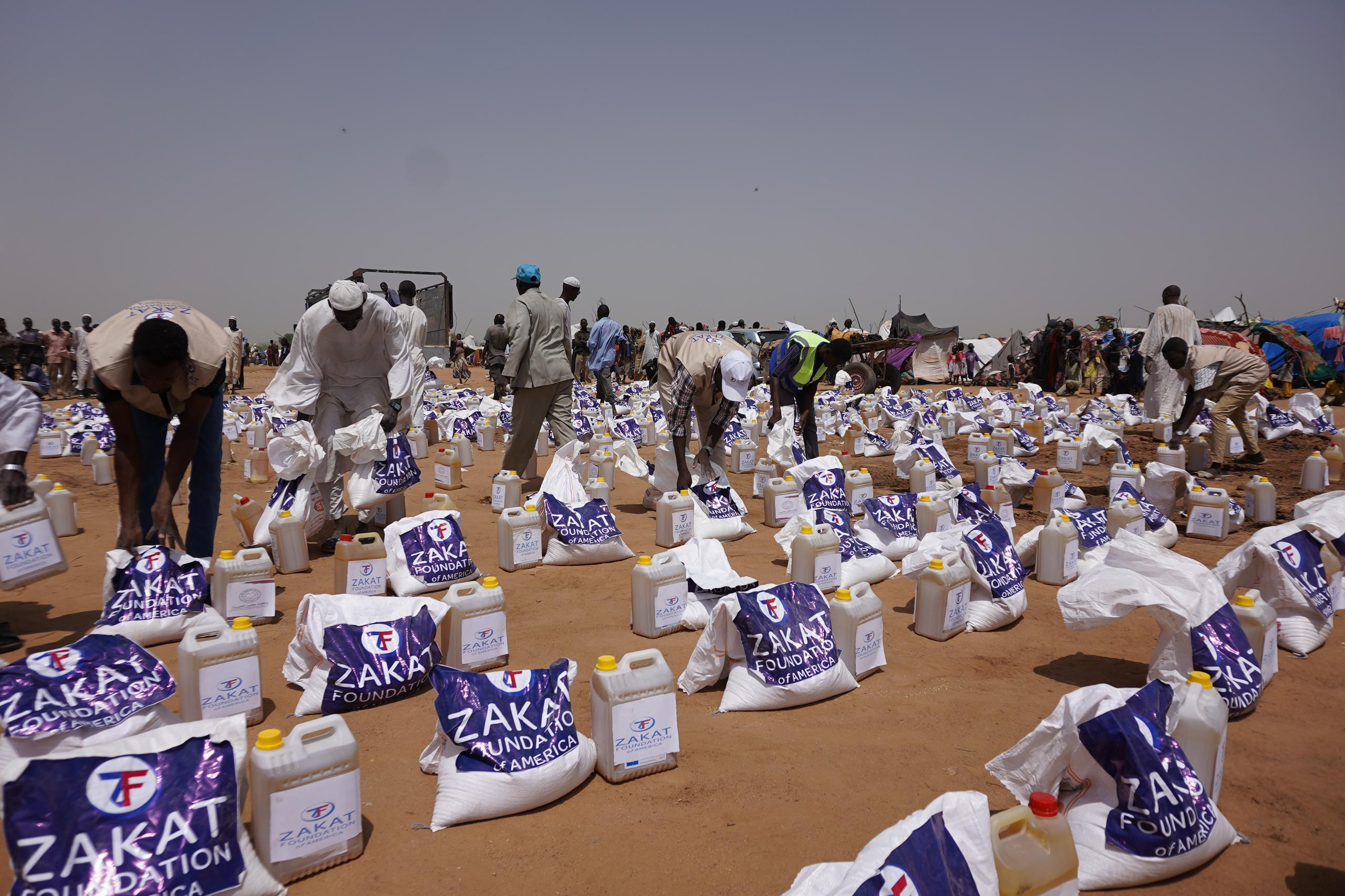 Essential food staples being prepared for distribution for displaced families in Sudan