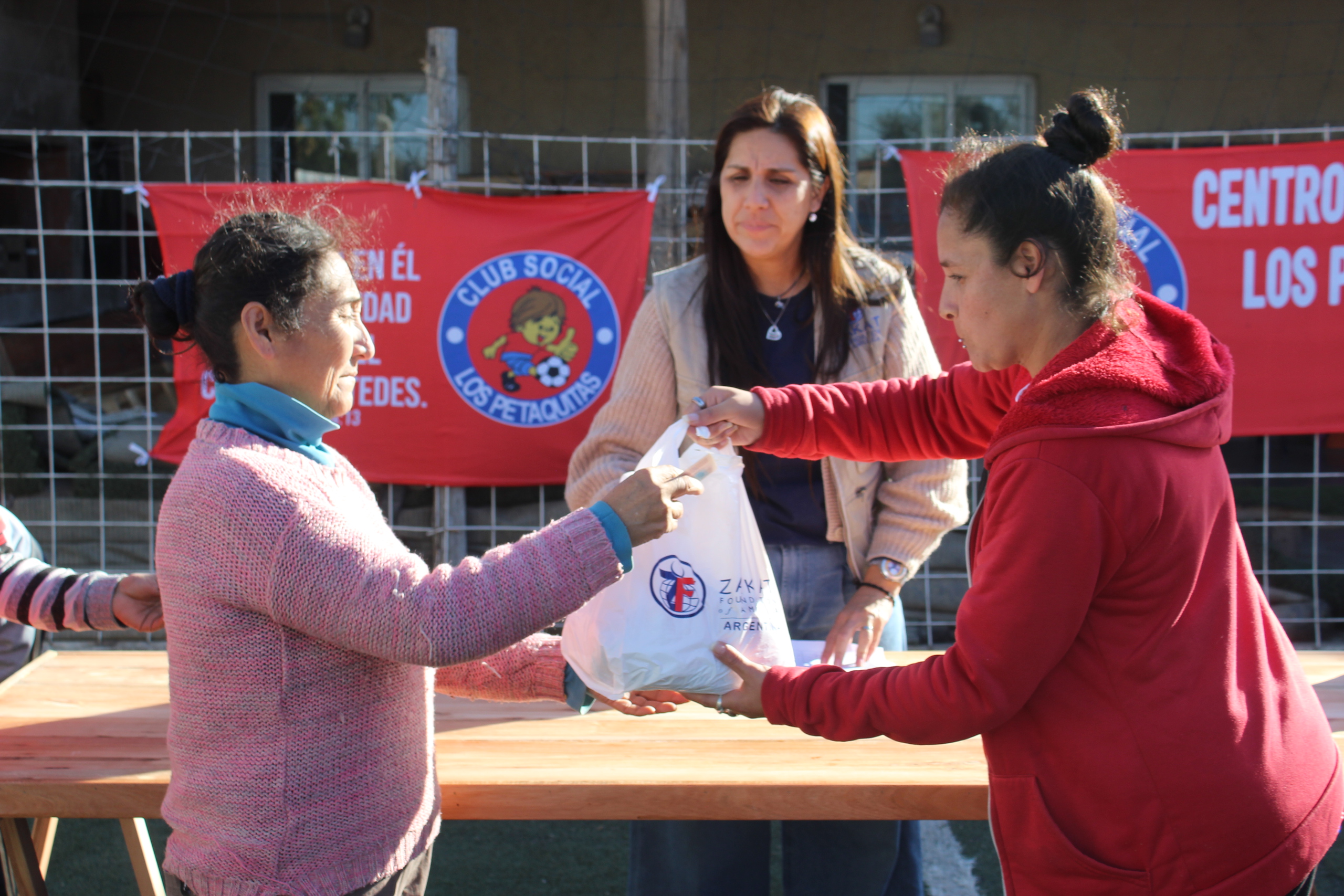 Families in Argentina enjoy Udhiyah meat at our distribution sight