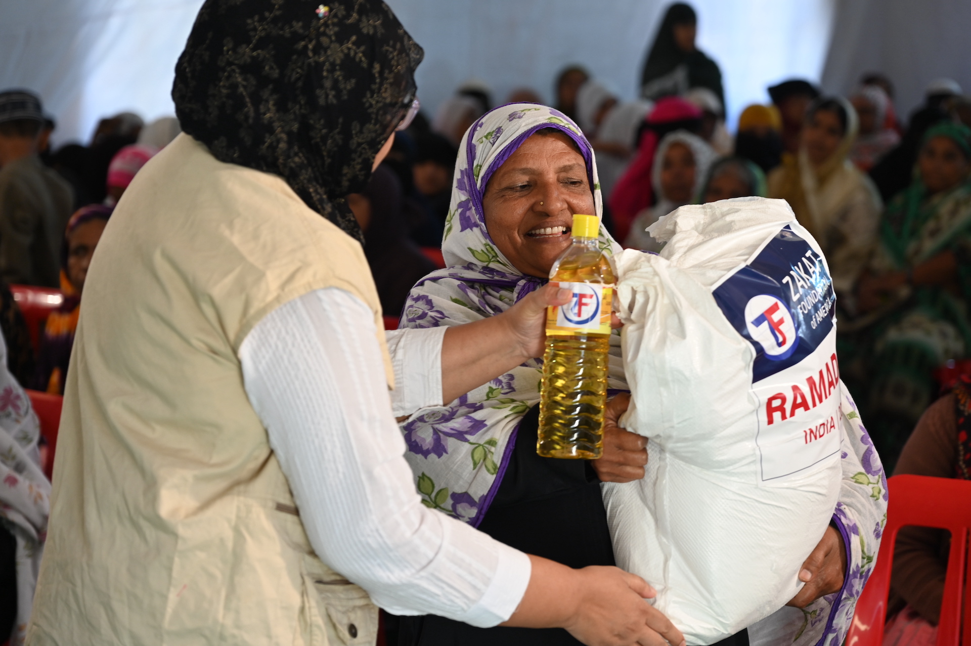 Families in India receive Ramadan food packages with staples to make lasting meals