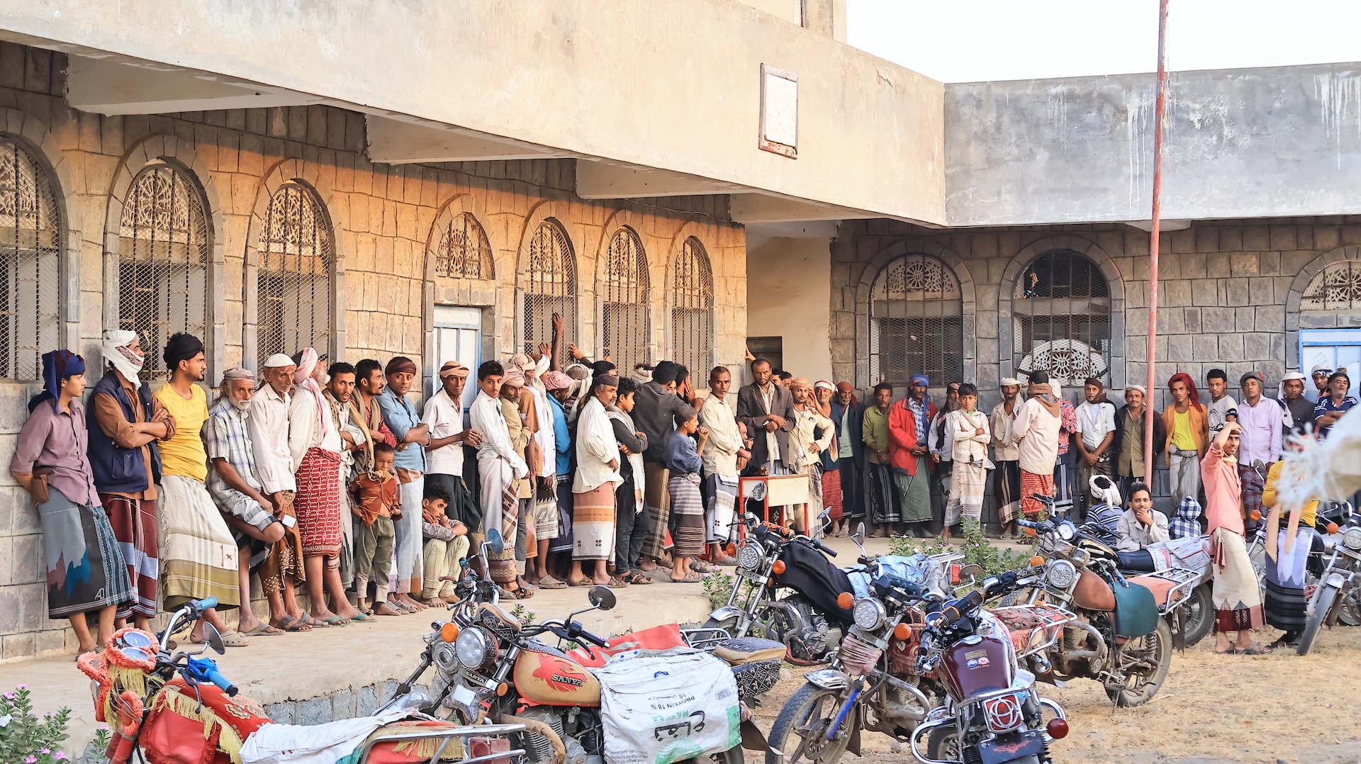 Families line up for food support in Ramadan
