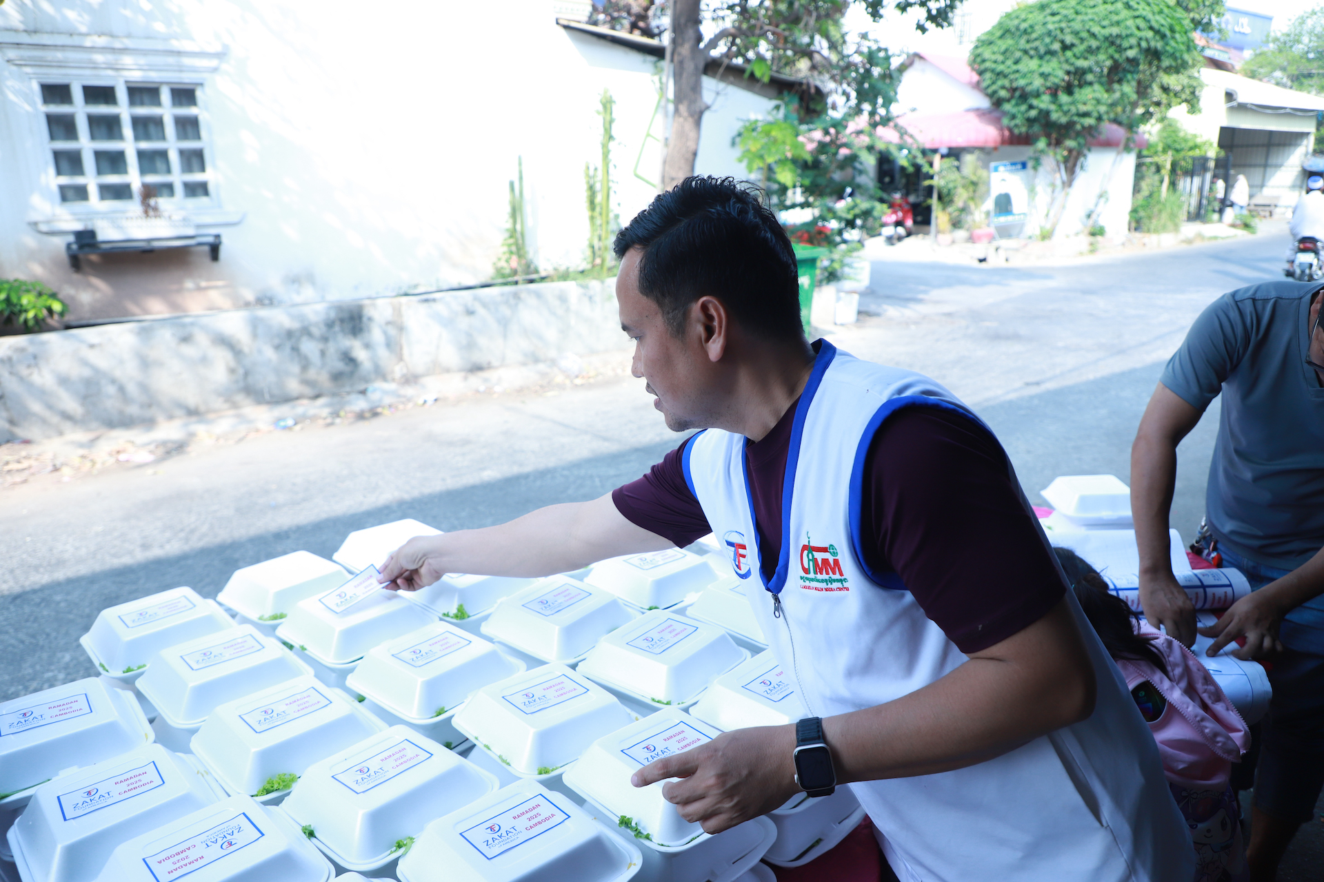 Hot iftar meals are prepared for distribution