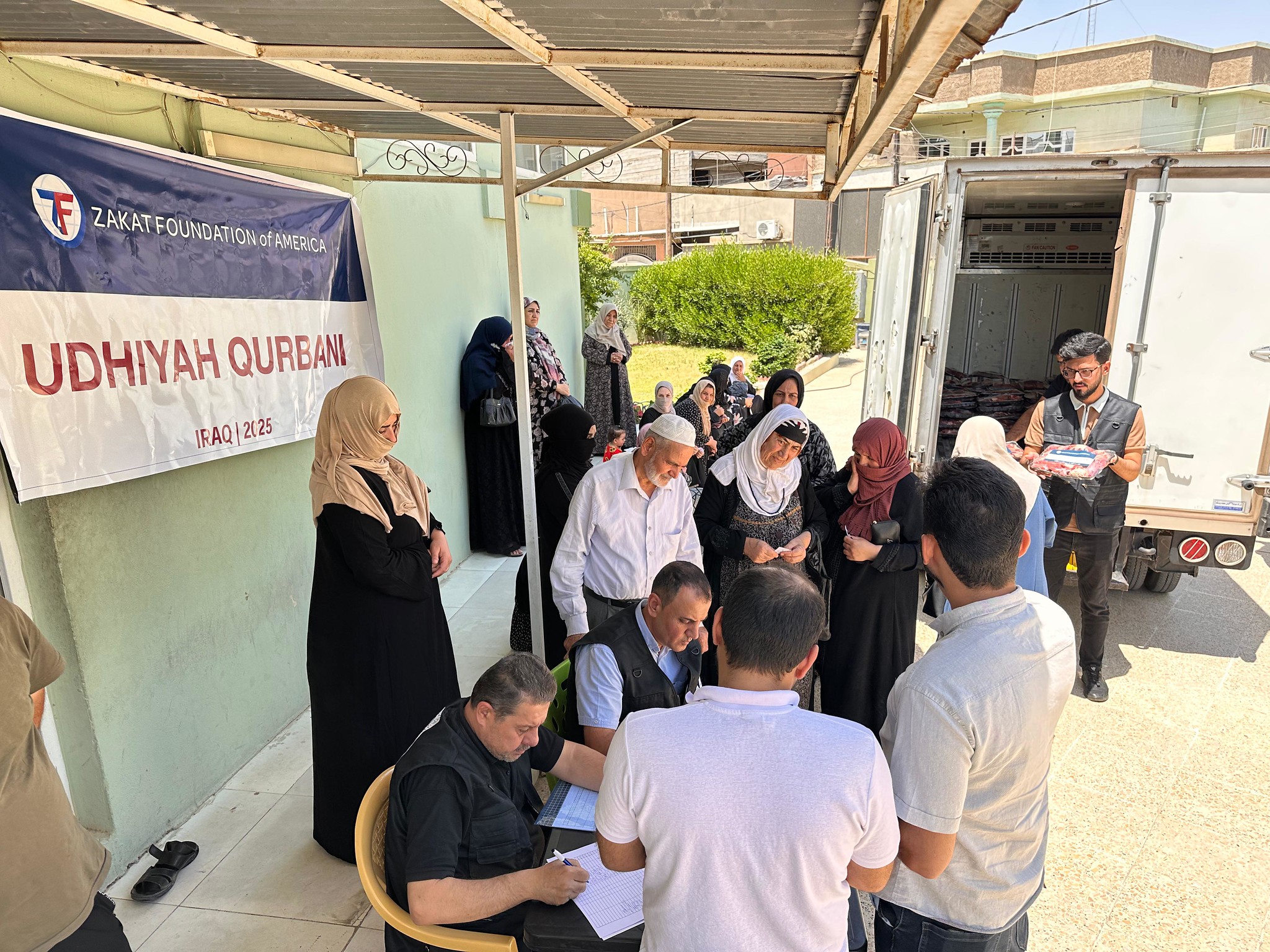 Iraqi families line up to collect nutritious Udhiyah-Qurbani meat packages