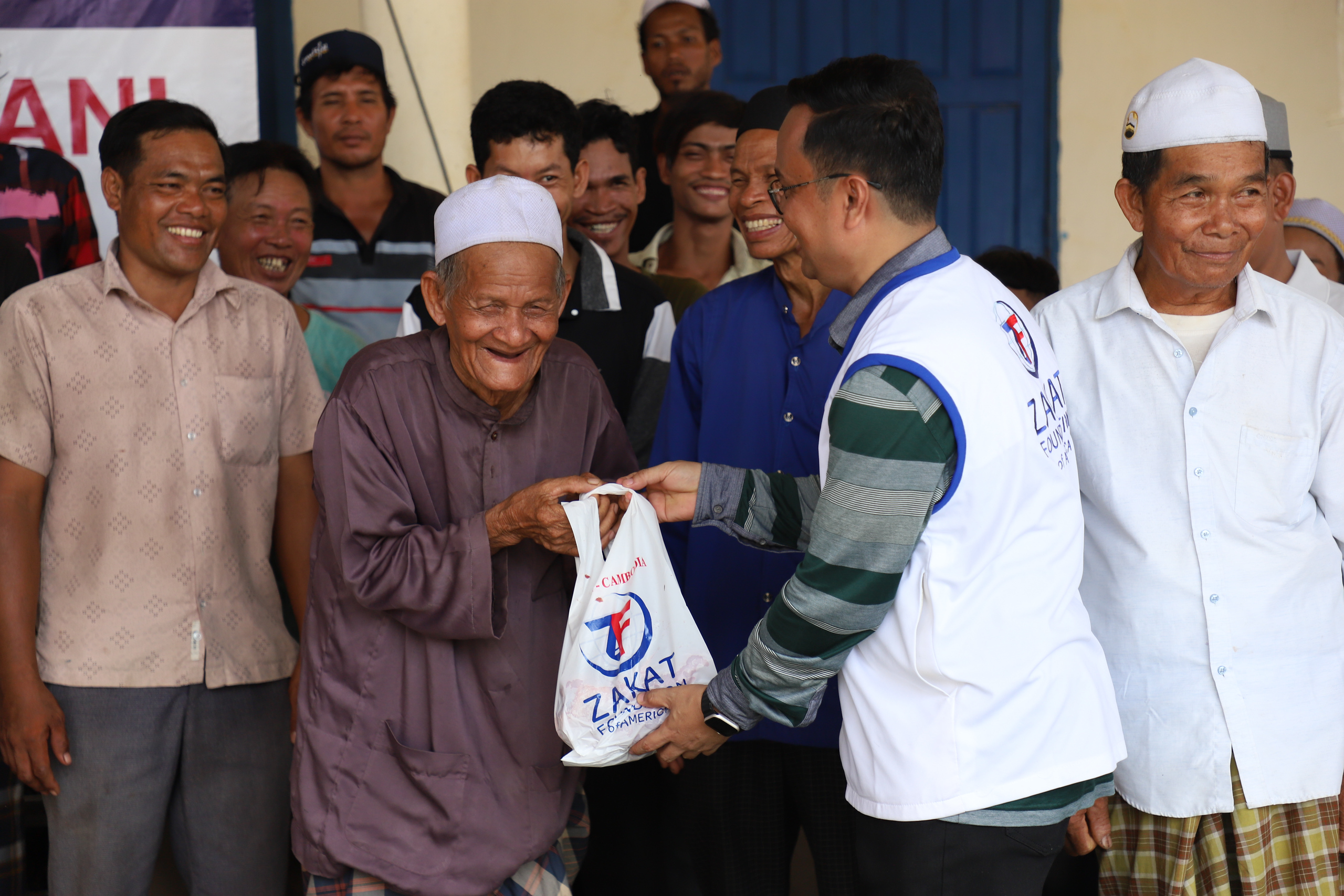 Joyful faces collect their Udhiyah-Qurbani shares to enjoy a nourishing meal
