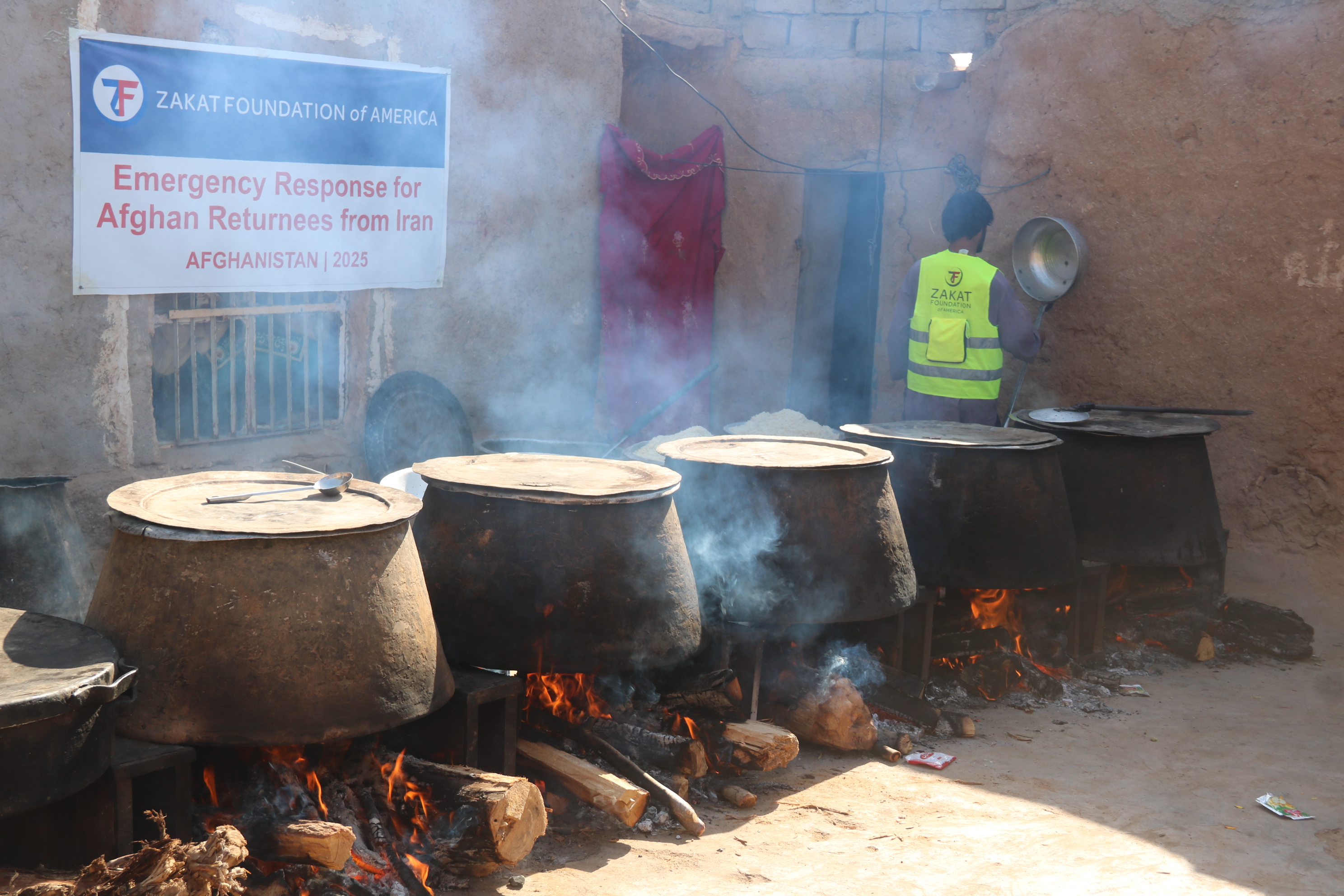 Nourishing hot meals prepared for Afghan refugees returning from Iran