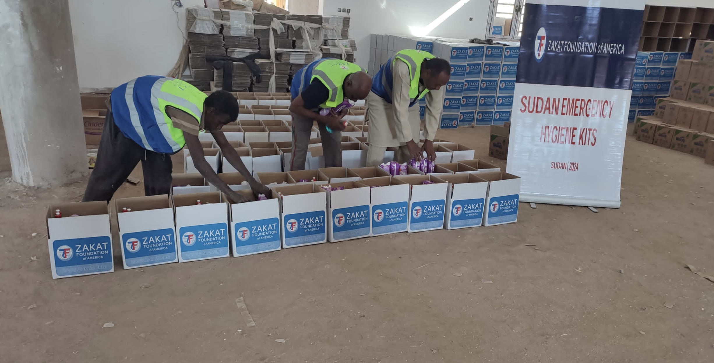 Our field team in Sudan packs hygiene kits with essentials for families in need