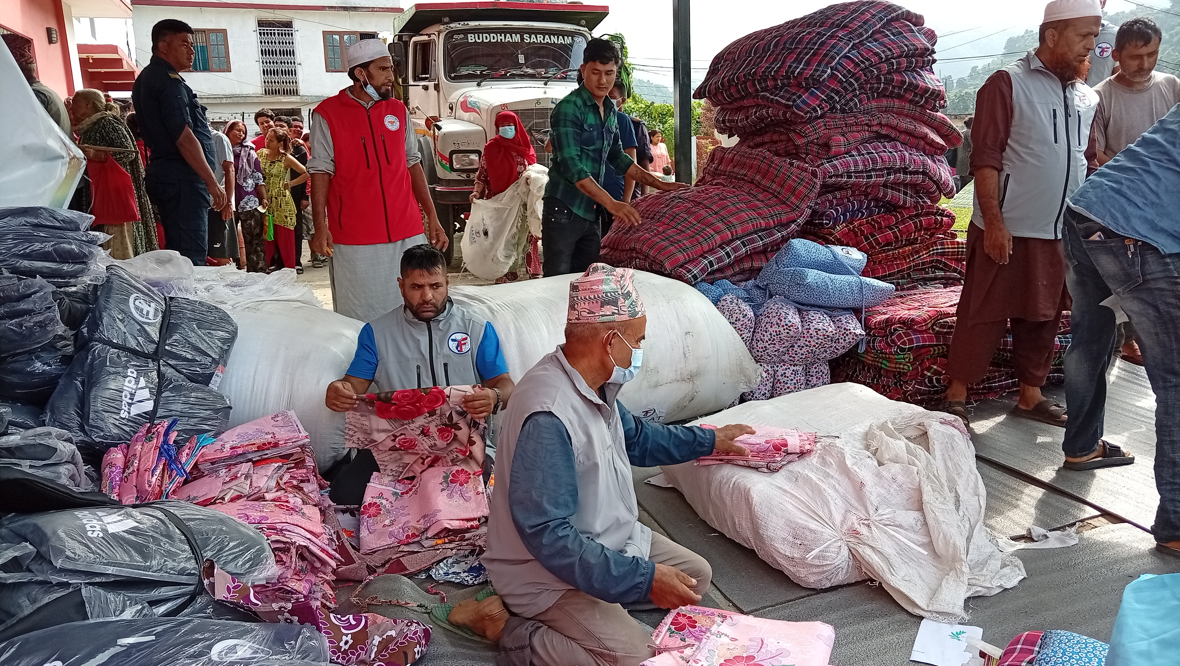 Our Nepal team unpacks and organizes new sheets and blankets