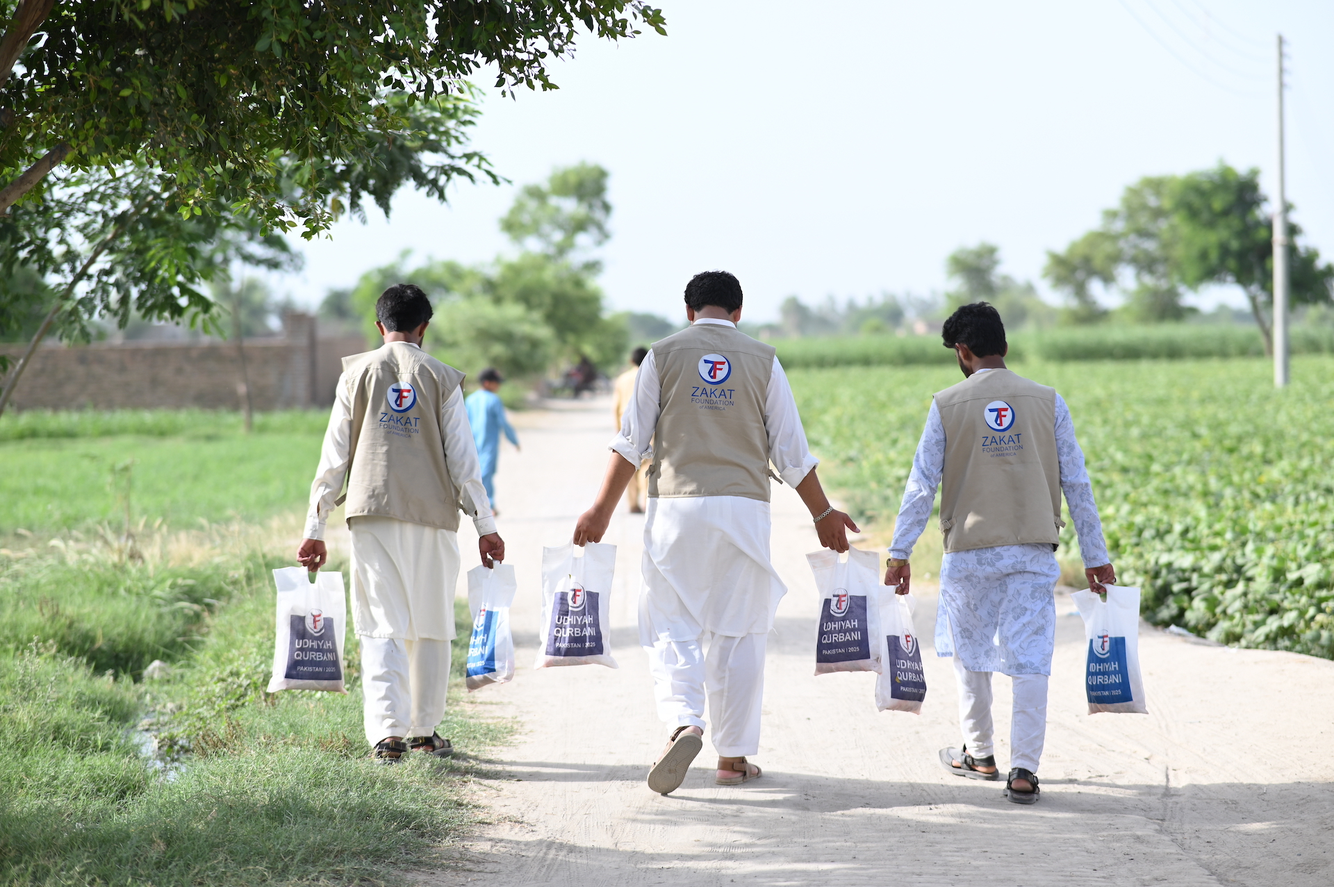 Our team members go door to door to distribute Udhiyah-Qurbani shares to needy families in Pakistan
