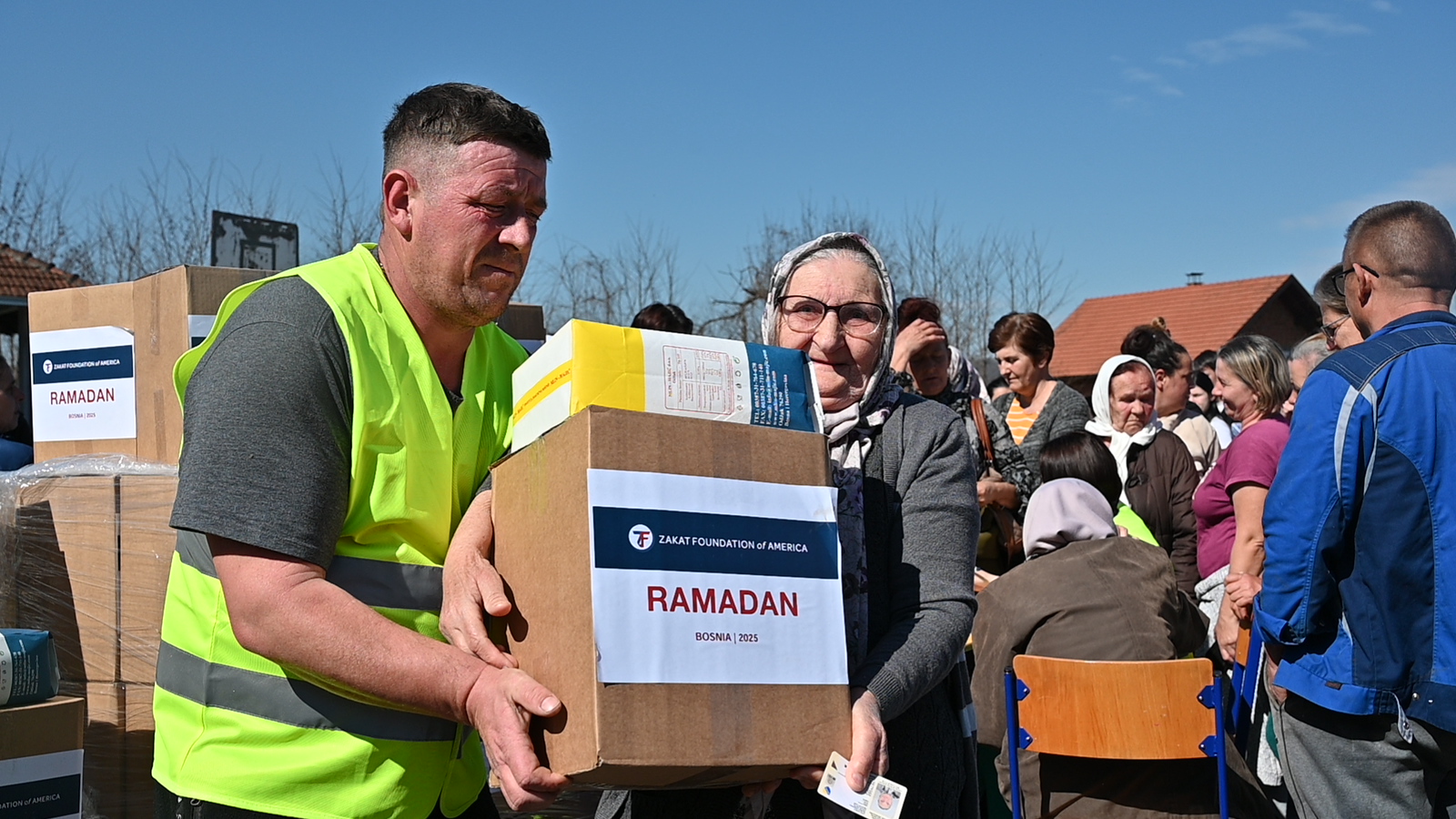 Our team members help families in Bosnia with Ramadan food packages full of essentials