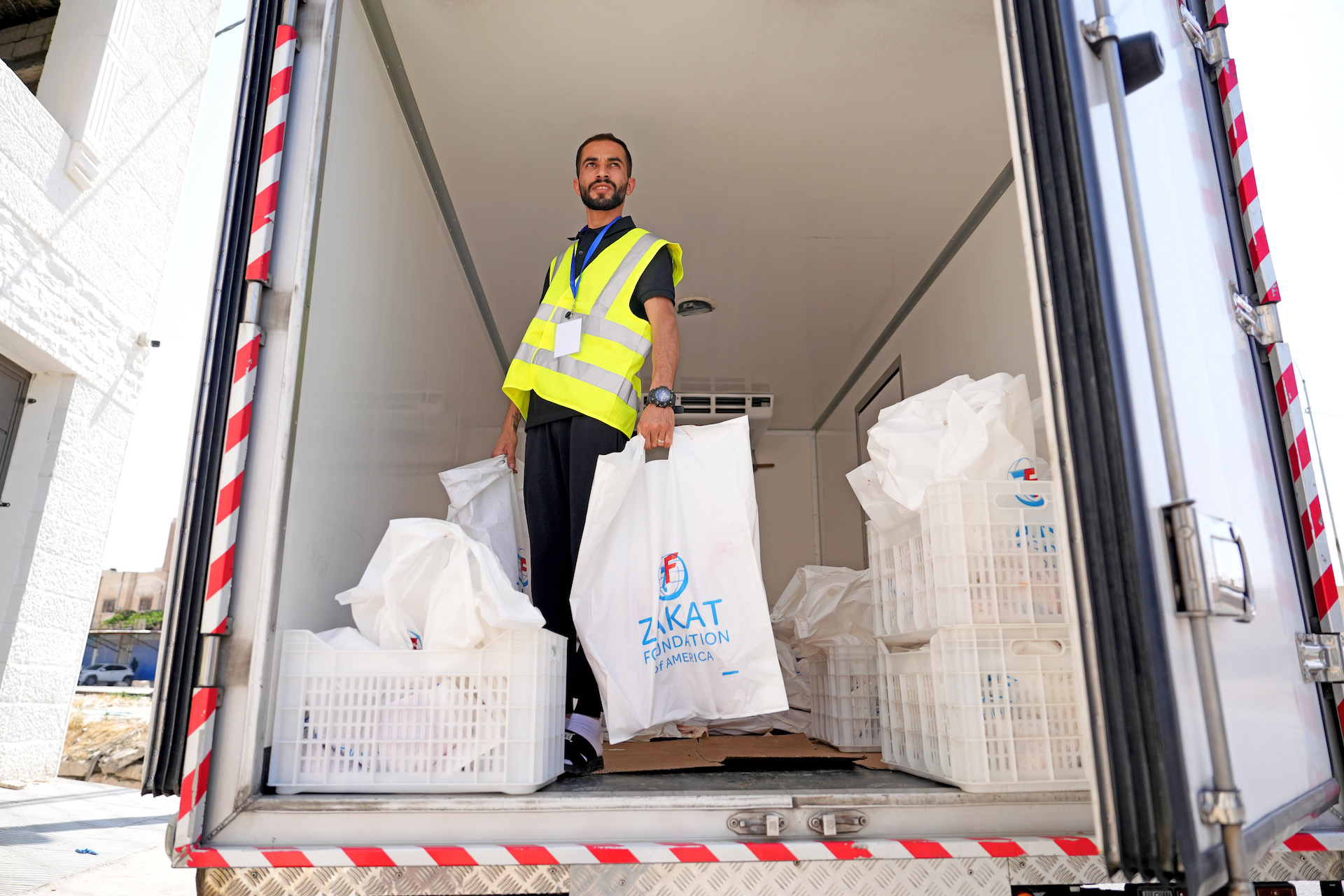 Our team members prepare to distribute Udhiyah-Qurbani shares to needy families