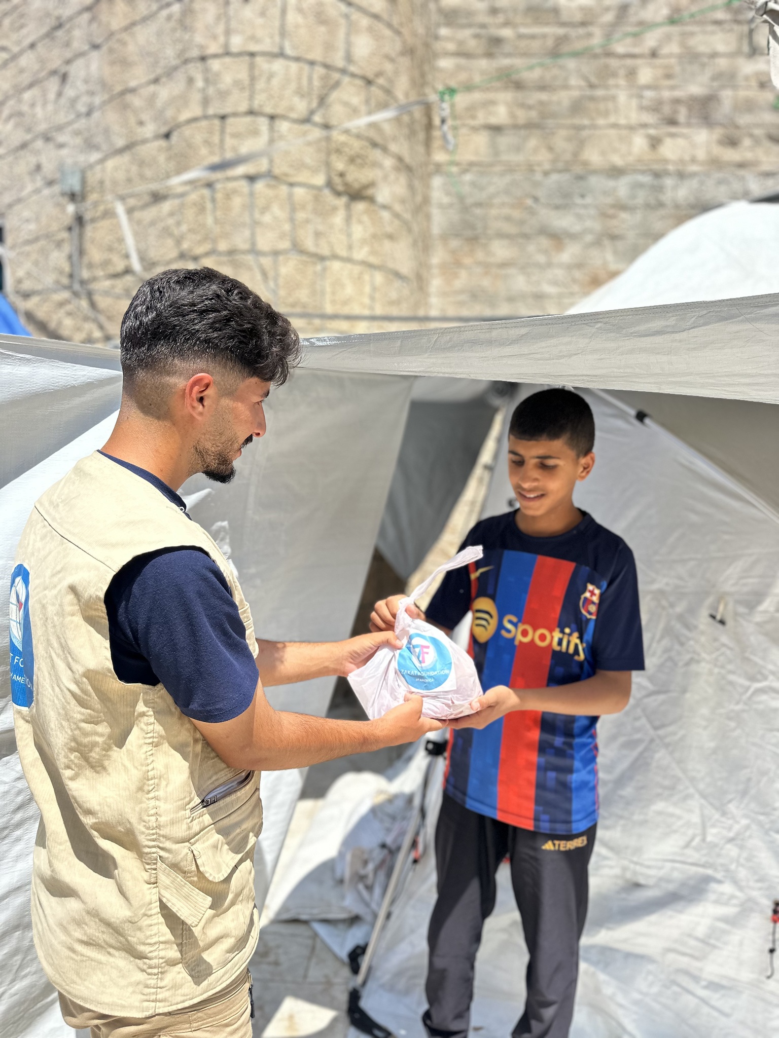 Displaced families receive food packages for nourishment