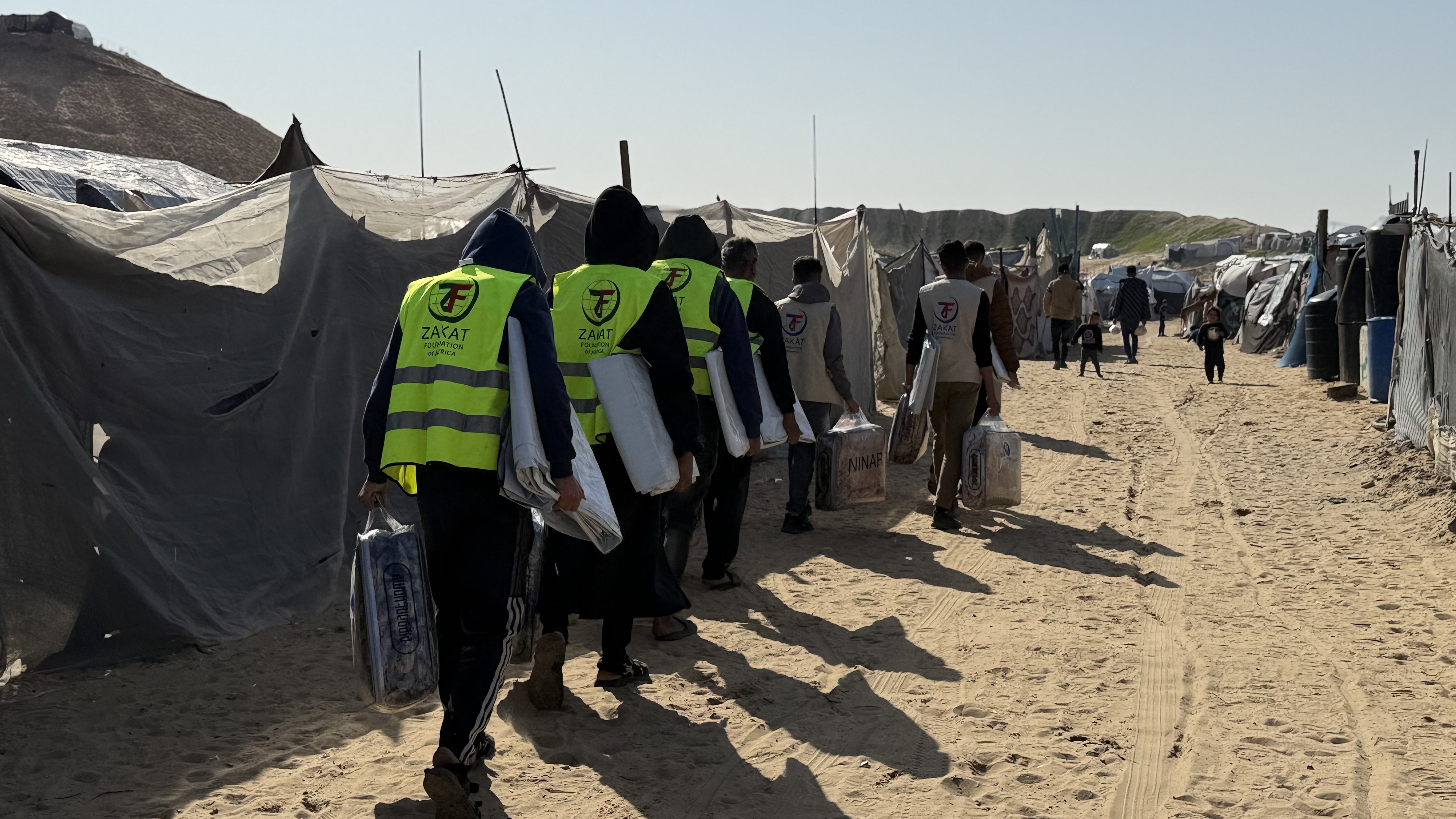 Our teams carry winter items for warmth to distribute to displaced families facing the weather elements