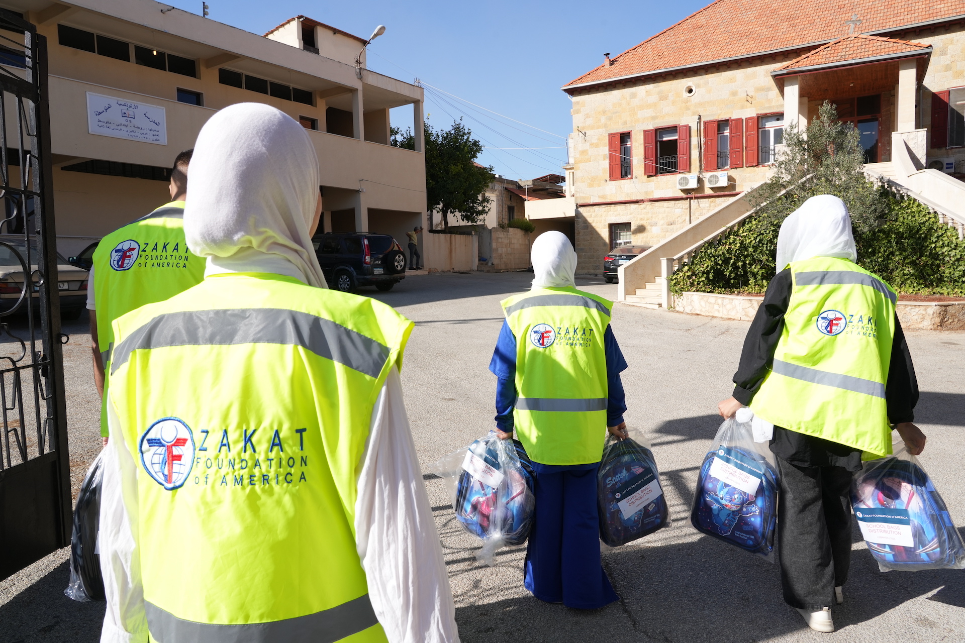 Our teams visit a local school to drop off new backpacks and school supplies