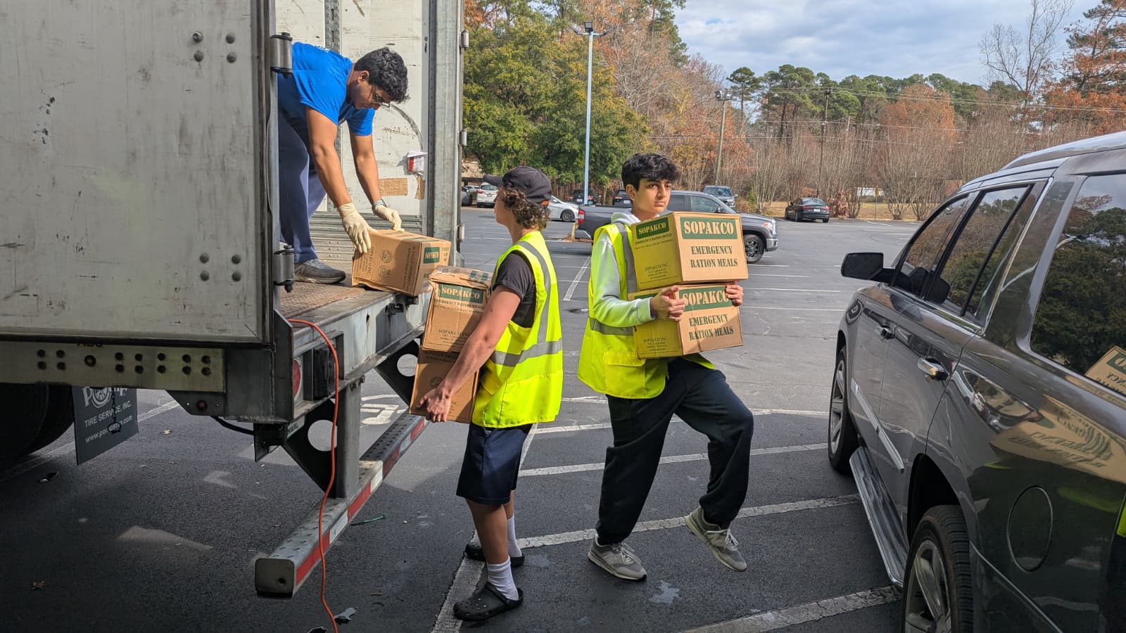 Our youth volunteers assist with food distributions from our local offices