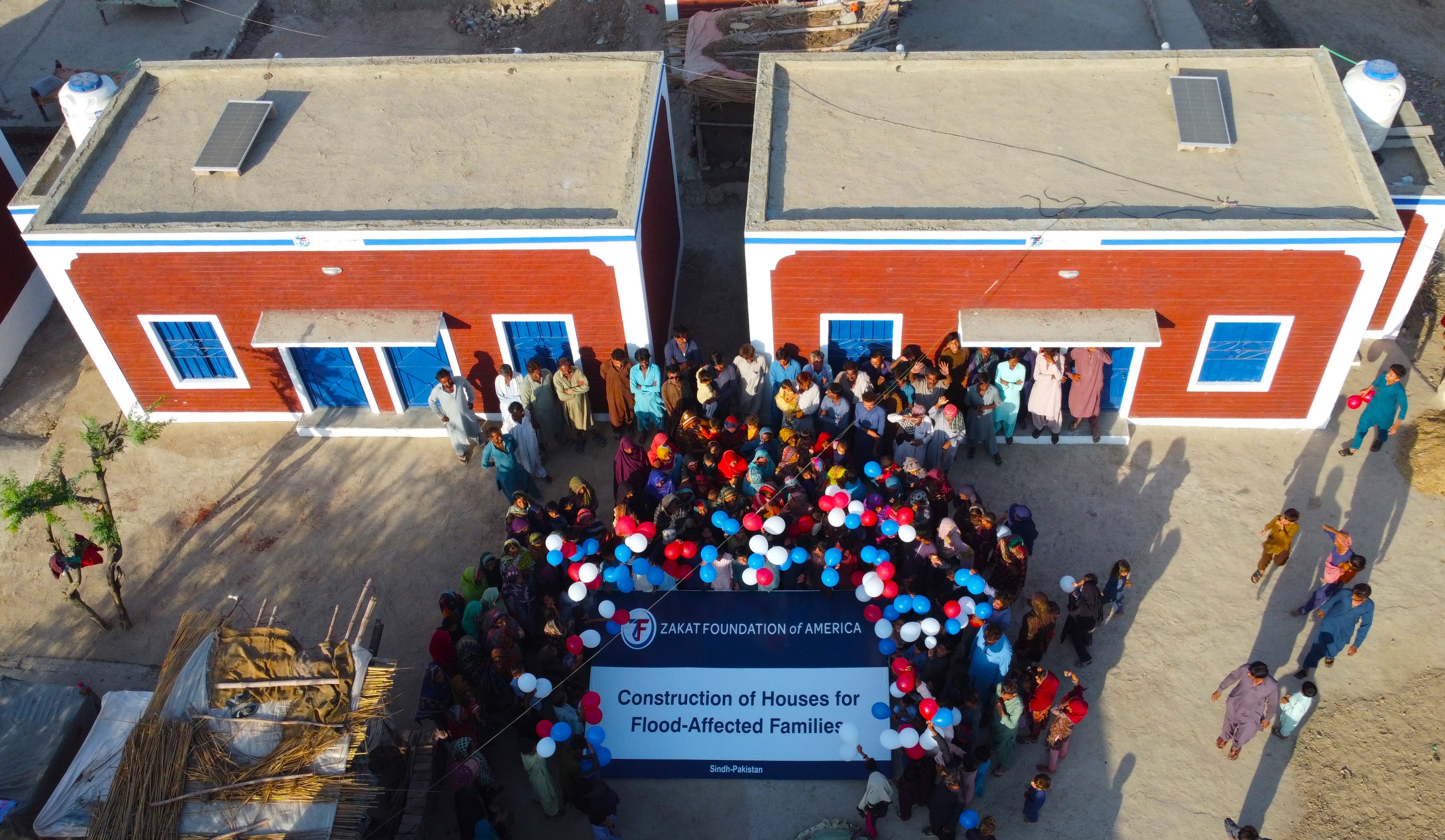 Pakistan flood affected families celebrate their newly constructed homes