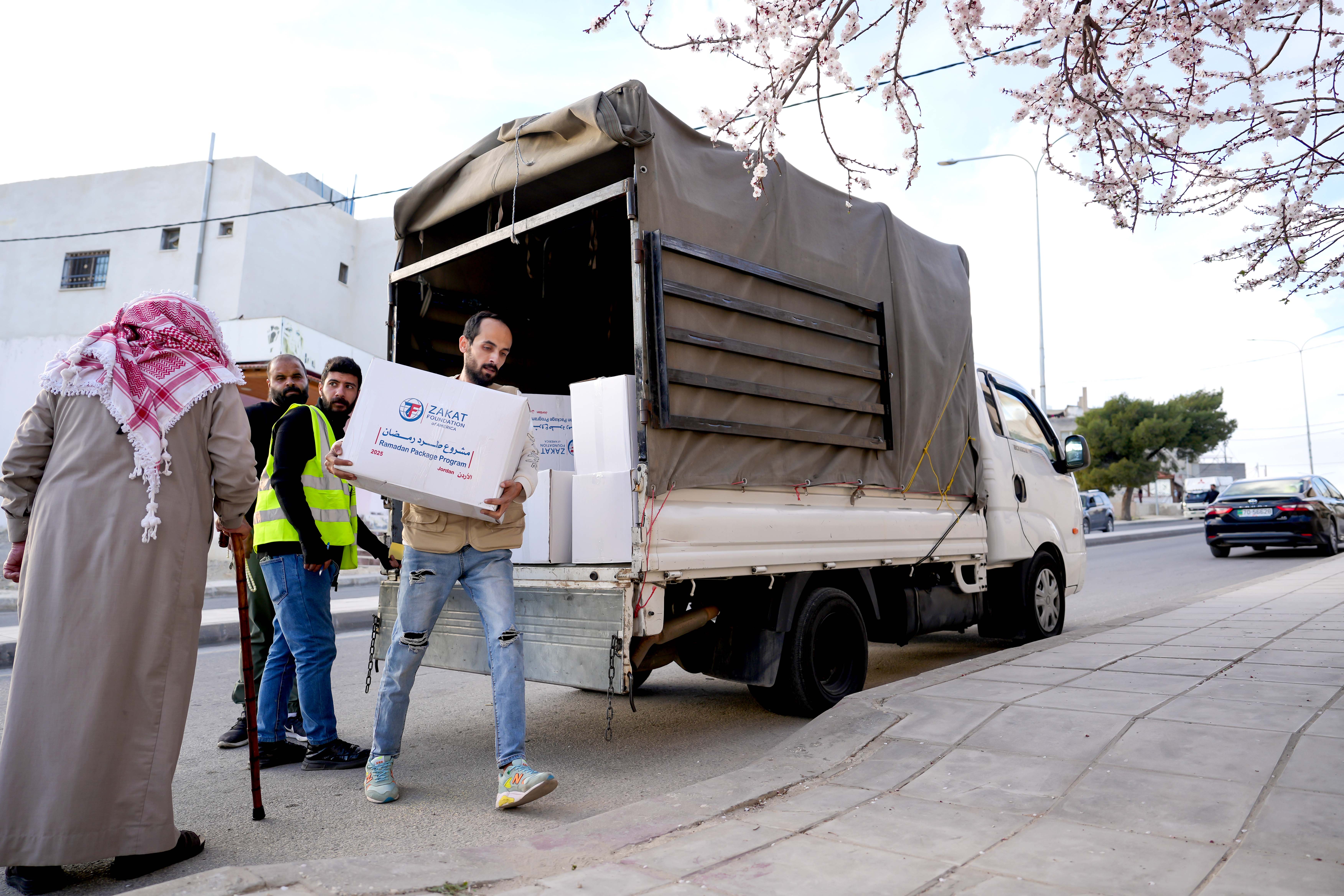 Ramadan food packages are distributed to families with staple items for iftar