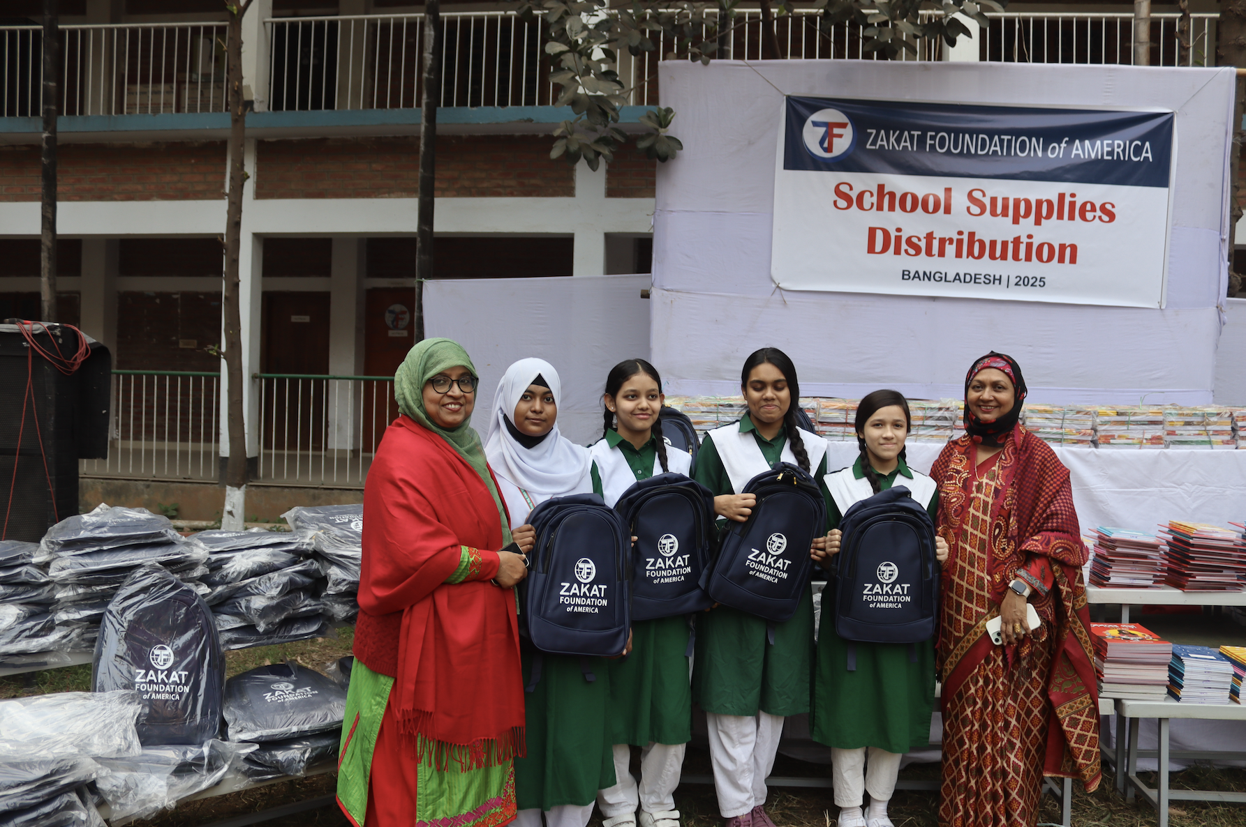 School girls in Bangladesh are excited to receive supplies to further their studies