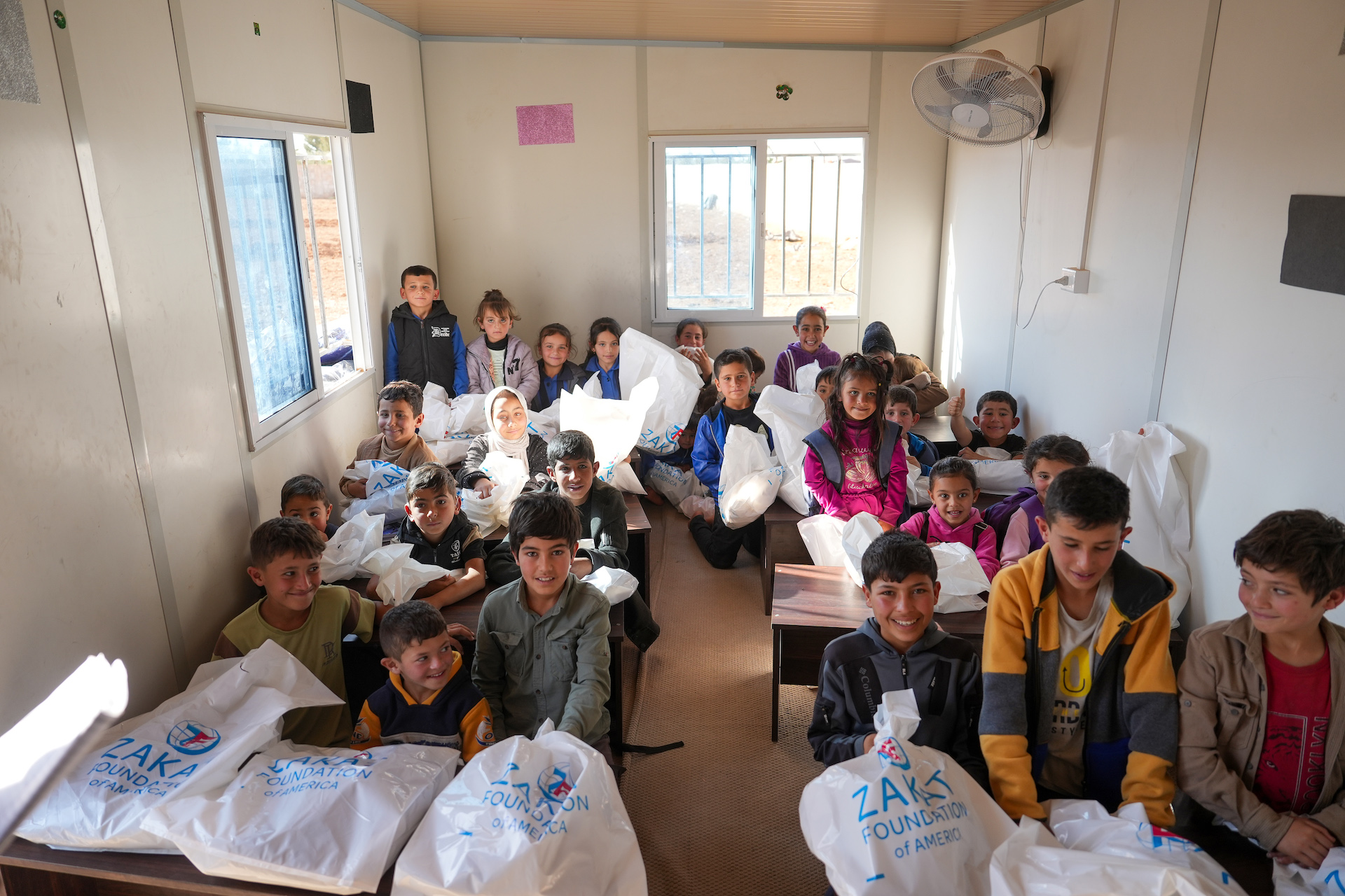 School is in session and students receive winter essentials to keep warm