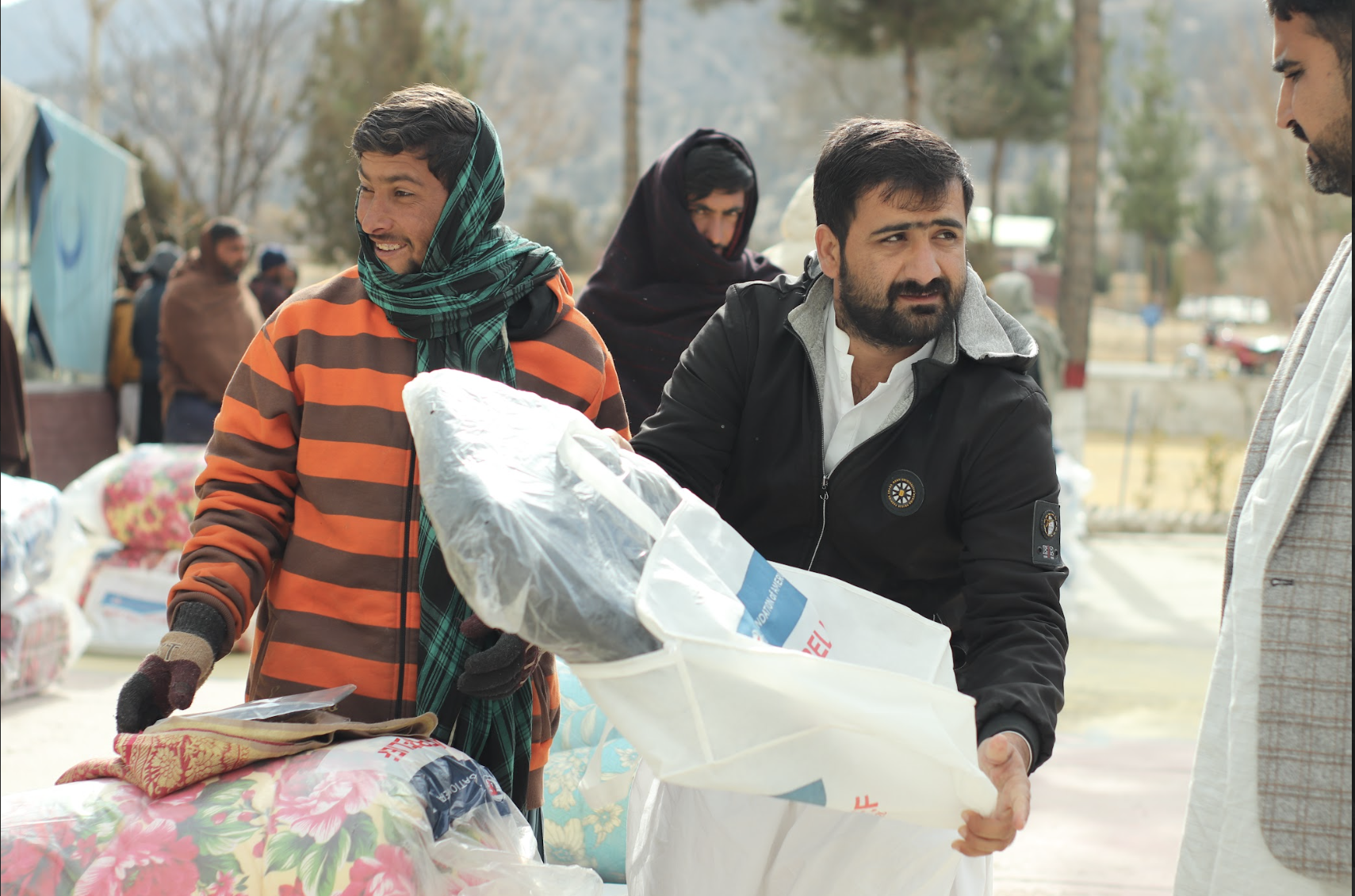 Families in Pakistan receive blankets and coats to protect them from the cold