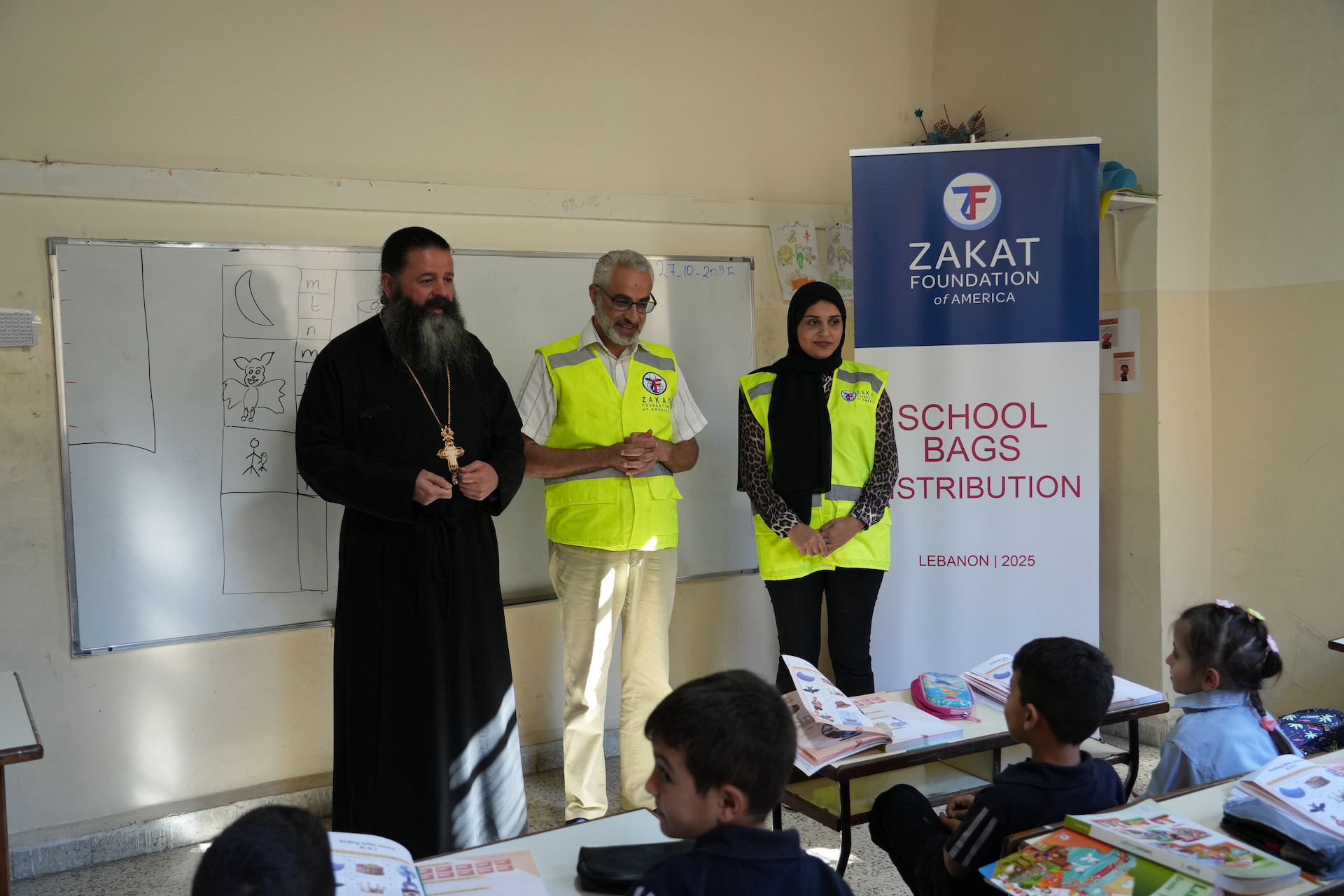 The teacher addresses the class and is ready to share the surprise of new supplies