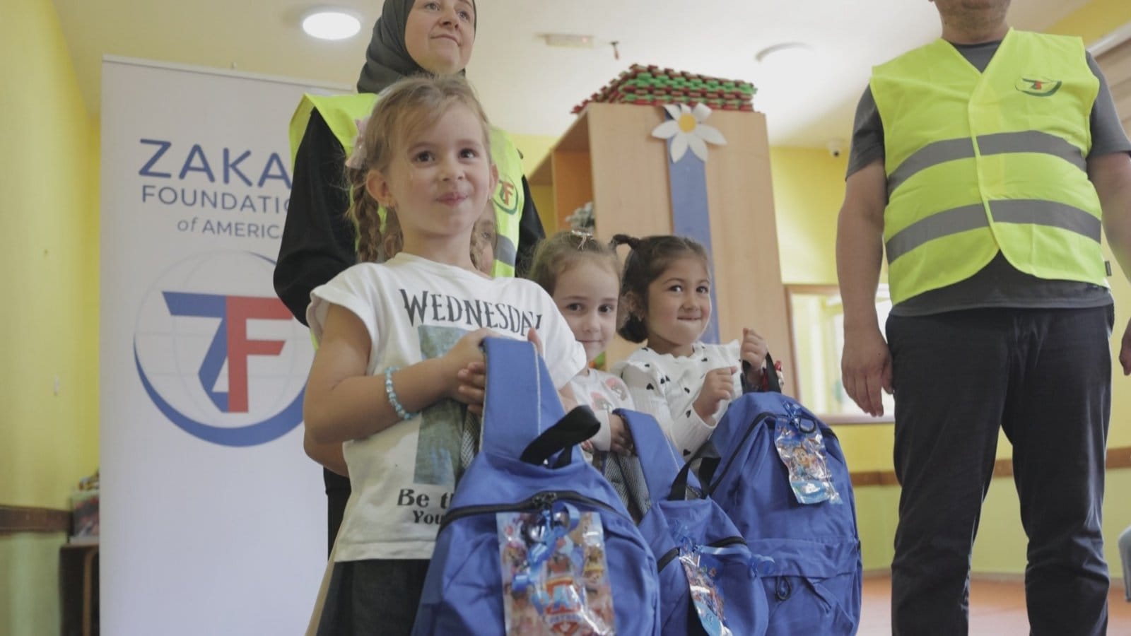 With their new backpacks and stationary young school girls are ready to take on the day