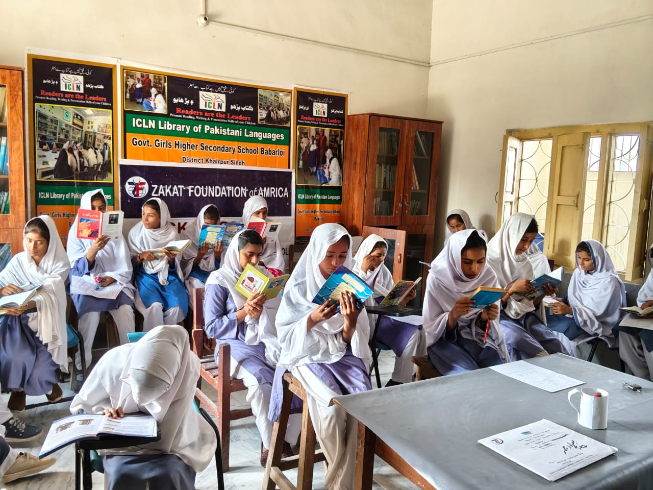 Young students eagerly read their texts for a new semester